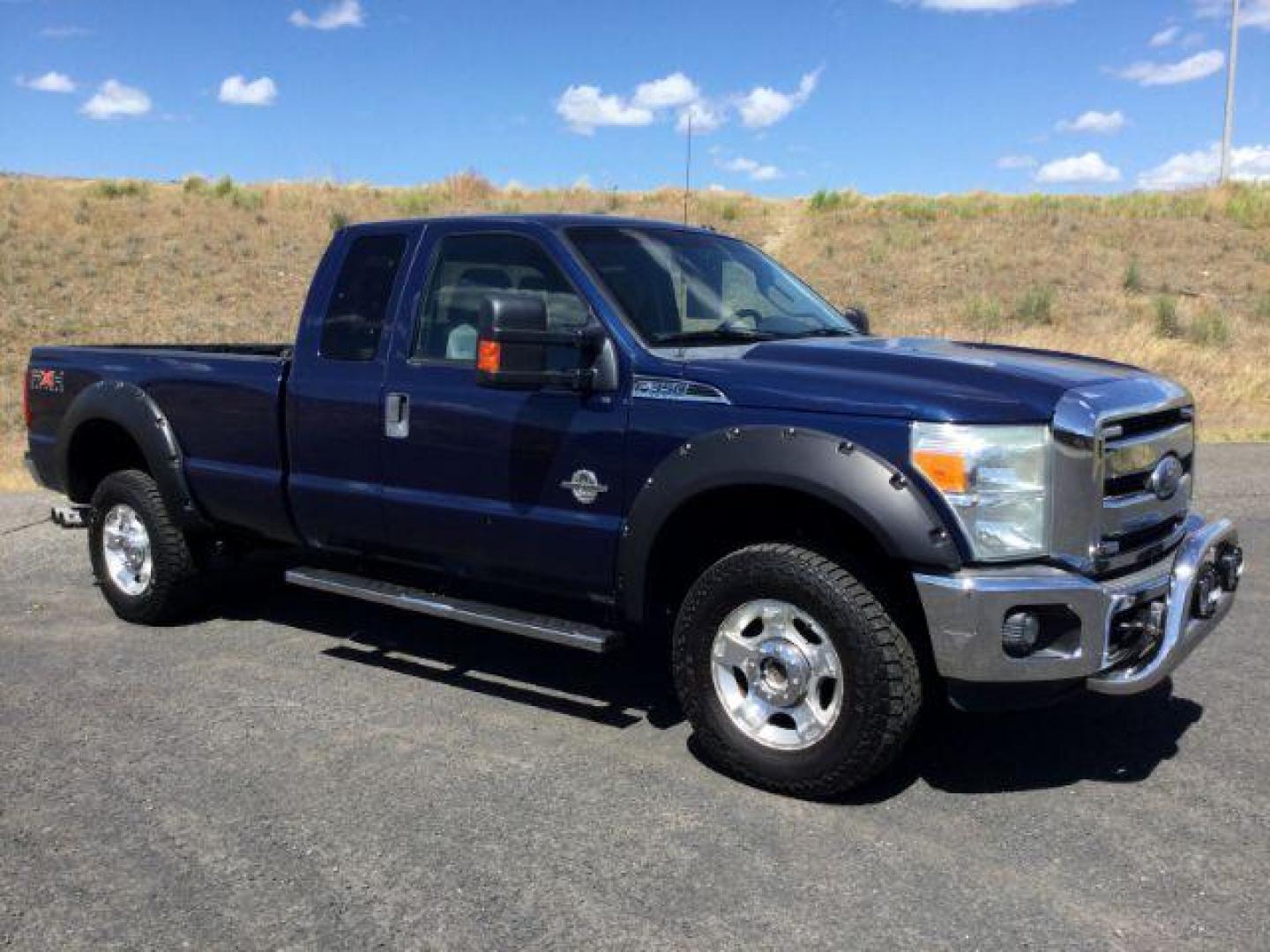 2011 Dark Blue Pearl /Steel Cloth Interior Ford F-350 SD XLT SuperCab 4WD (1FT8X3BT0BE) with an 6.7L V8 OHV 16V DIESEL engine, 6-Speed Automatic transmission, located at 1801 Main Street, Lewiston, 83501, (208) 743-9371, 46.417065, -117.004799 - Photo#0