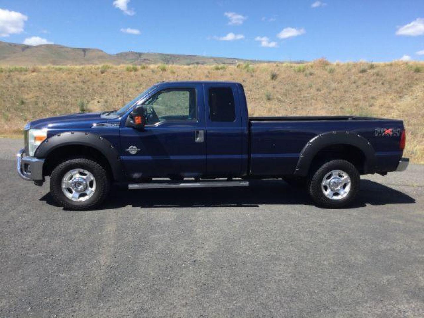 2011 Dark Blue Pearl /Steel Cloth Interior Ford F-350 SD XLT SuperCab 4WD (1FT8X3BT0BE) with an 6.7L V8 OHV 16V DIESEL engine, 6-Speed Automatic transmission, located at 1801 Main Street, Lewiston, 83501, (208) 743-9371, 46.417065, -117.004799 - Photo#2