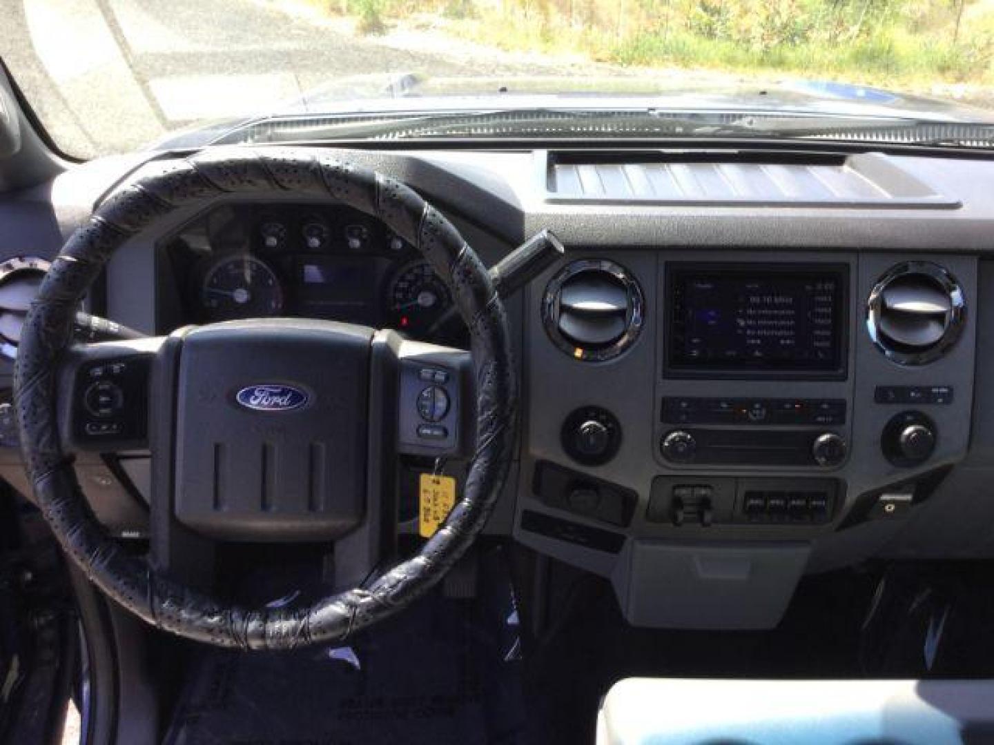 2011 Dark Blue Pearl /Steel Cloth Interior Ford F-350 SD XLT SuperCab 4WD (1FT8X3BT0BE) with an 6.7L V8 OHV 16V DIESEL engine, 6-Speed Automatic transmission, located at 1801 Main Street, Lewiston, 83501, (208) 743-9371, 46.417065, -117.004799 - Photo#4
