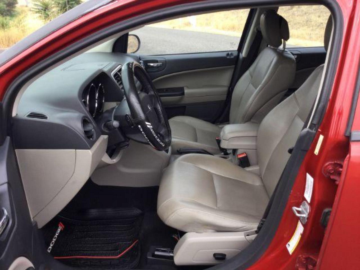 2010 Inferno Red Crystal Pearlcoat /Dark Slate/Medium Graystone Leather Interior Dodge Caliber Uptown (1B3CB9HB9AD) with an 2.4L L4 DOHC 16V engine, Continuously Variable Transmission transmission, located at 1801 Main Street, Lewiston, 83501, (208) 743-9371, 46.417065, -117.004799 - Photo#3