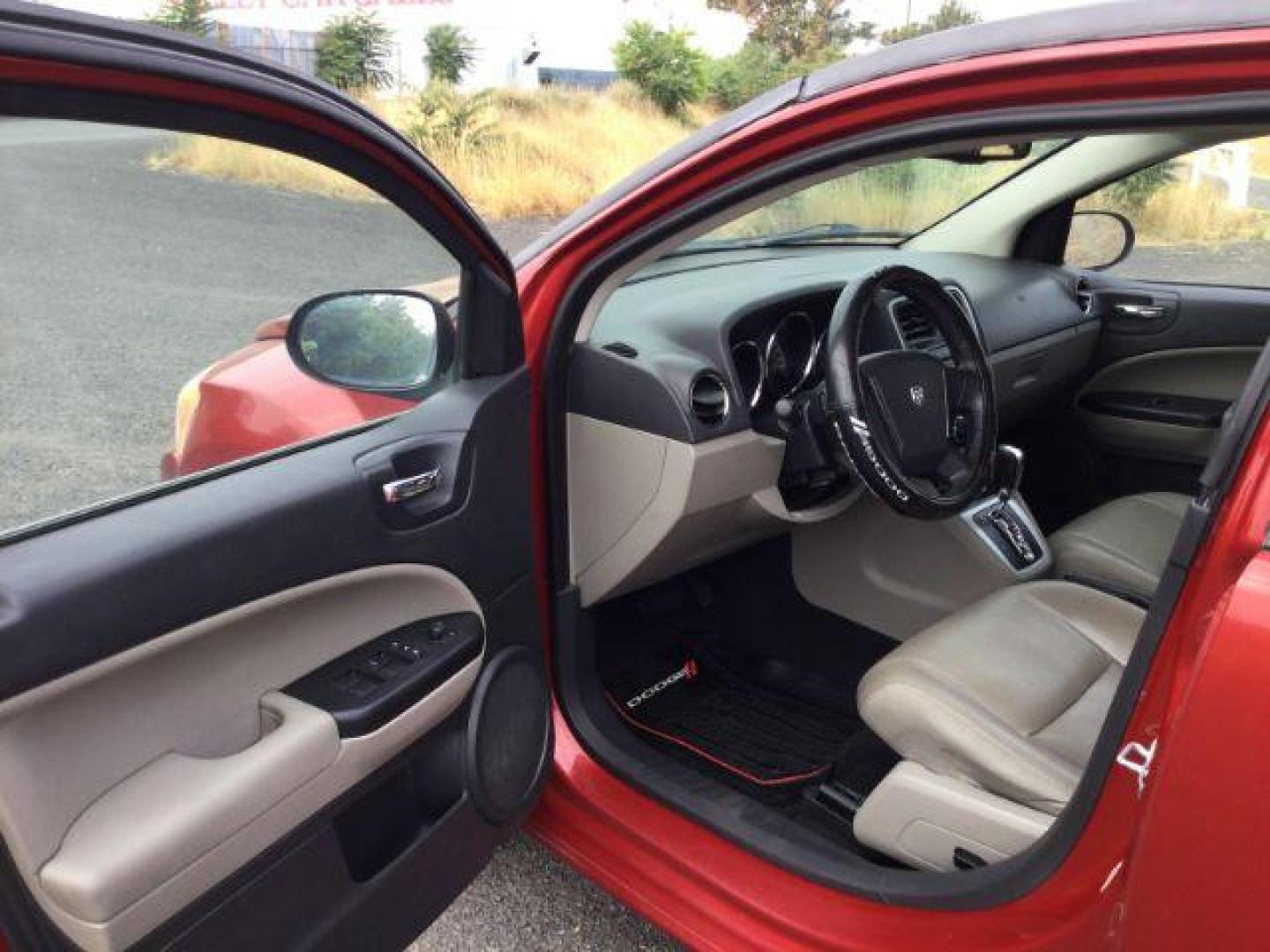 2010 Inferno Red Crystal Pearlcoat /Dark Slate/Medium Graystone Leather Interior Dodge Caliber Uptown (1B3CB9HB9AD) with an 2.4L L4 DOHC 16V engine, Continuously Variable Transmission transmission, located at 1801 Main Street, Lewiston, 83501, (208) 743-9371, 46.417065, -117.004799 - Photo#4