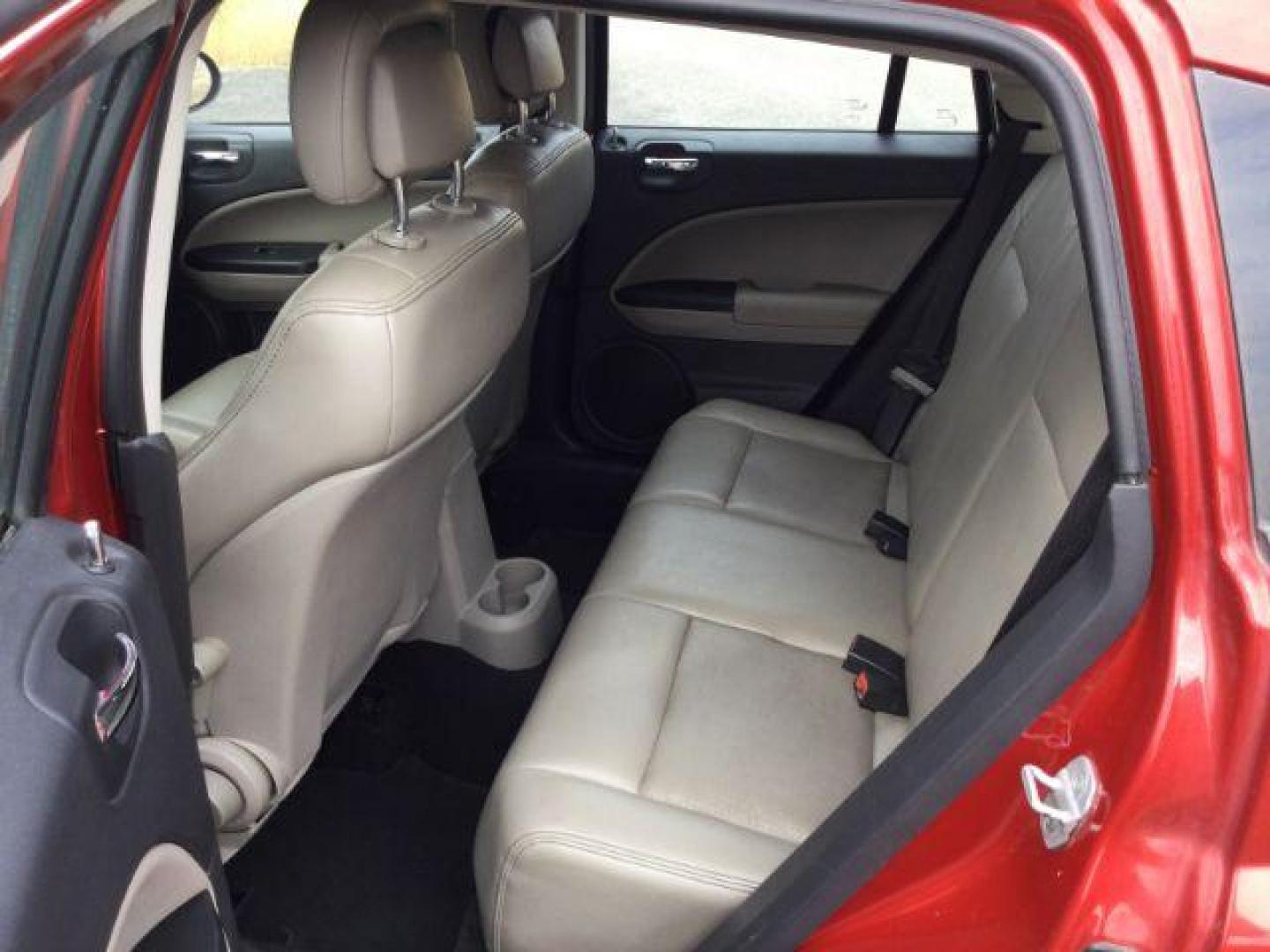 2010 Inferno Red Crystal Pearlcoat /Dark Slate/Medium Graystone Leather Interior Dodge Caliber Uptown (1B3CB9HB9AD) with an 2.4L L4 DOHC 16V engine, Continuously Variable Transmission transmission, located at 1801 Main Street, Lewiston, 83501, (208) 743-9371, 46.417065, -117.004799 - Photo#5