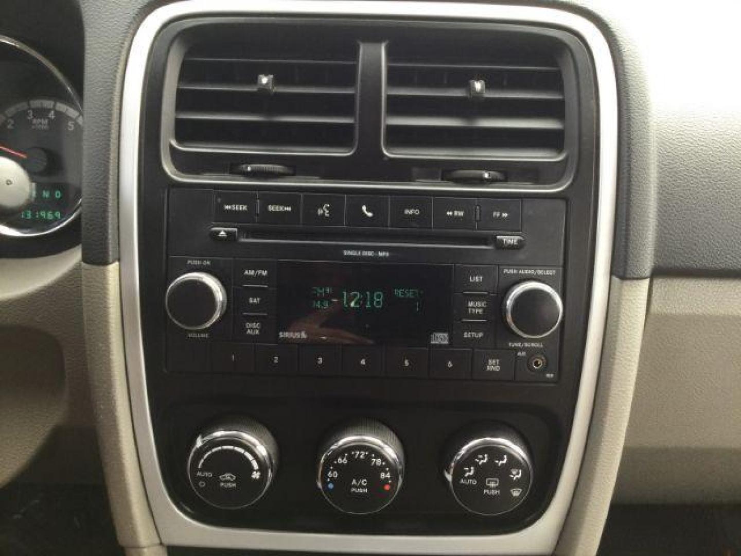 2010 Inferno Red Crystal Pearlcoat /Dark Slate/Medium Graystone Leather Interior Dodge Caliber Uptown (1B3CB9HB9AD) with an 2.4L L4 DOHC 16V engine, Continuously Variable Transmission transmission, located at 1801 Main Street, Lewiston, 83501, (208) 743-9371, 46.417065, -117.004799 - Photo#7