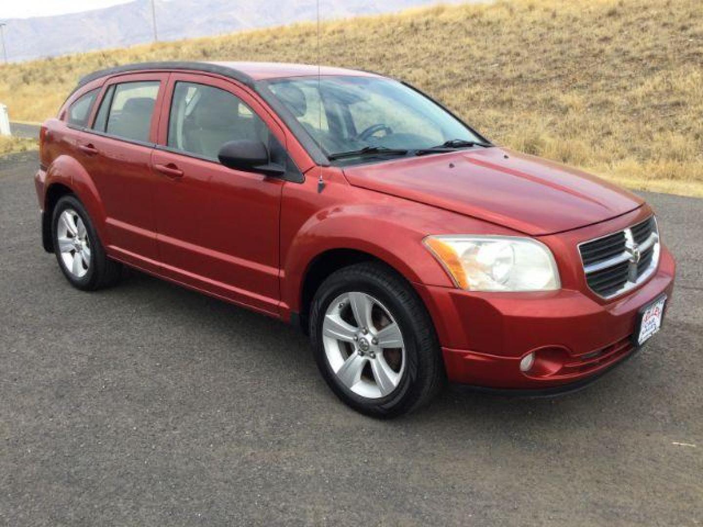 2010 Inferno Red Crystal Pearlcoat /Dark Slate/Medium Graystone Leather Interior Dodge Caliber Uptown (1B3CB9HB9AD) with an 2.4L L4 DOHC 16V engine, Continuously Variable Transmission transmission, located at 1801 Main Street, Lewiston, 83501, (208) 743-9371, 46.417065, -117.004799 - Photo#9