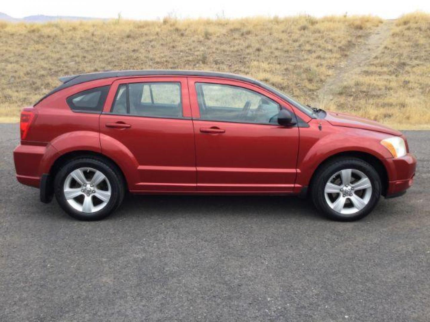 2010 Inferno Red Crystal Pearlcoat /Dark Slate/Medium Graystone Leather Interior Dodge Caliber Uptown (1B3CB9HB9AD) with an 2.4L L4 DOHC 16V engine, Continuously Variable Transmission transmission, located at 1801 Main Street, Lewiston, 83501, (208) 743-9371, 46.417065, -117.004799 - Photo#10
