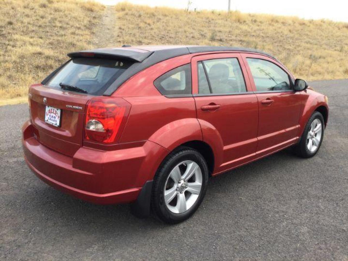 2010 Inferno Red Crystal Pearlcoat /Dark Slate/Medium Graystone Leather Interior Dodge Caliber Uptown (1B3CB9HB9AD) with an 2.4L L4 DOHC 16V engine, Continuously Variable Transmission transmission, located at 1801 Main Street, Lewiston, 83501, (208) 743-9371, 46.417065, -117.004799 - Photo#11