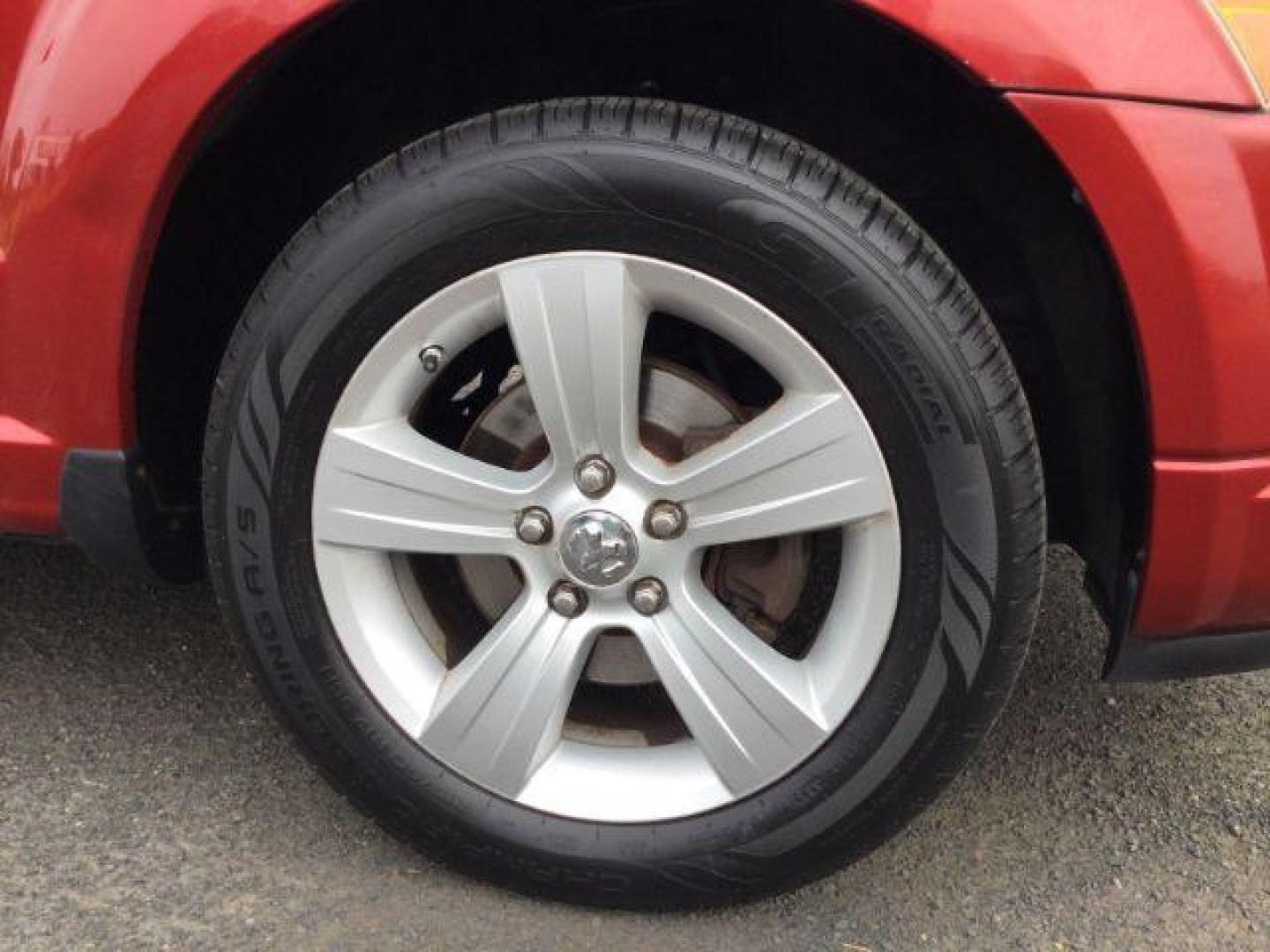 2010 Inferno Red Crystal Pearlcoat /Dark Slate/Medium Graystone Leather Interior Dodge Caliber Uptown (1B3CB9HB9AD) with an 2.4L L4 DOHC 16V engine, Continuously Variable Transmission transmission, located at 1801 Main Street, Lewiston, 83501, (208) 743-9371, 46.417065, -117.004799 - Photo#16