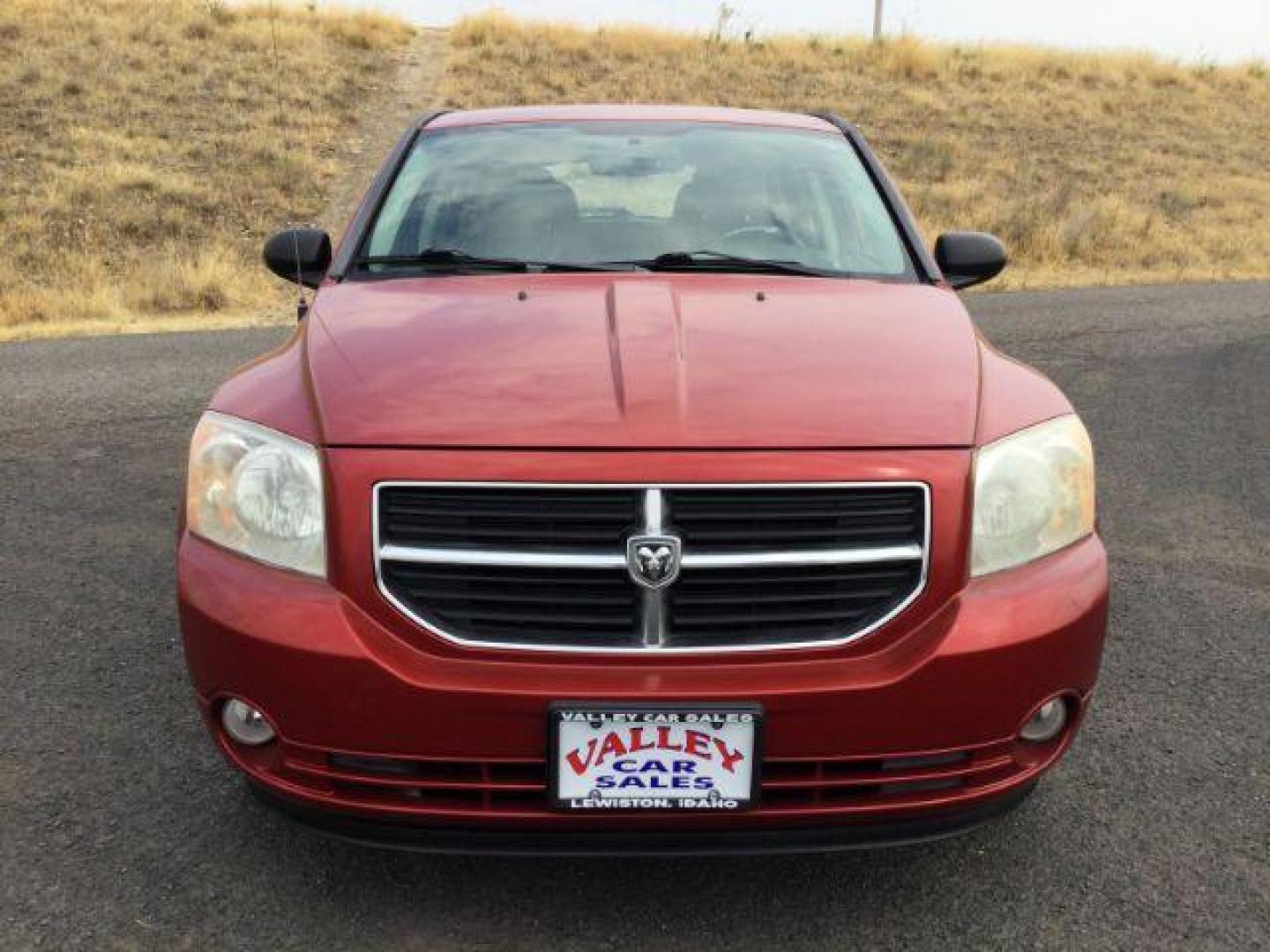 2010 Inferno Red Crystal Pearlcoat /Dark Slate/Medium Graystone Leather Interior Dodge Caliber Uptown (1B3CB9HB9AD) with an 2.4L L4 DOHC 16V engine, Continuously Variable Transmission transmission, located at 1801 Main Street, Lewiston, 83501, (208) 743-9371, 46.417065, -117.004799 - Photo#18