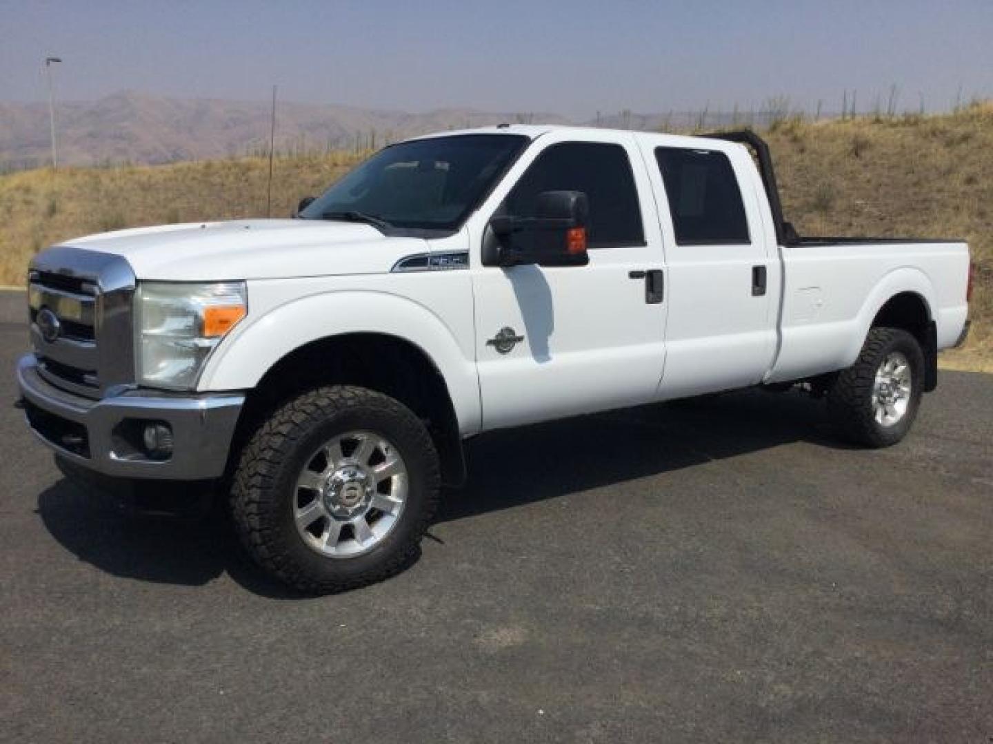 2012 Oxford White /Steel Cloth Interior Ford F-350 SD XLT Crew Cab Long Bed 4WD (1FT8W3BT9CE) with an 6.7L V8 OHV 16V DIESEL engine, 6-Speed Automatic transmission, located at 1801 Main Street, Lewiston, 83501, (208) 743-9371, 46.417065, -117.004799- Photo#1