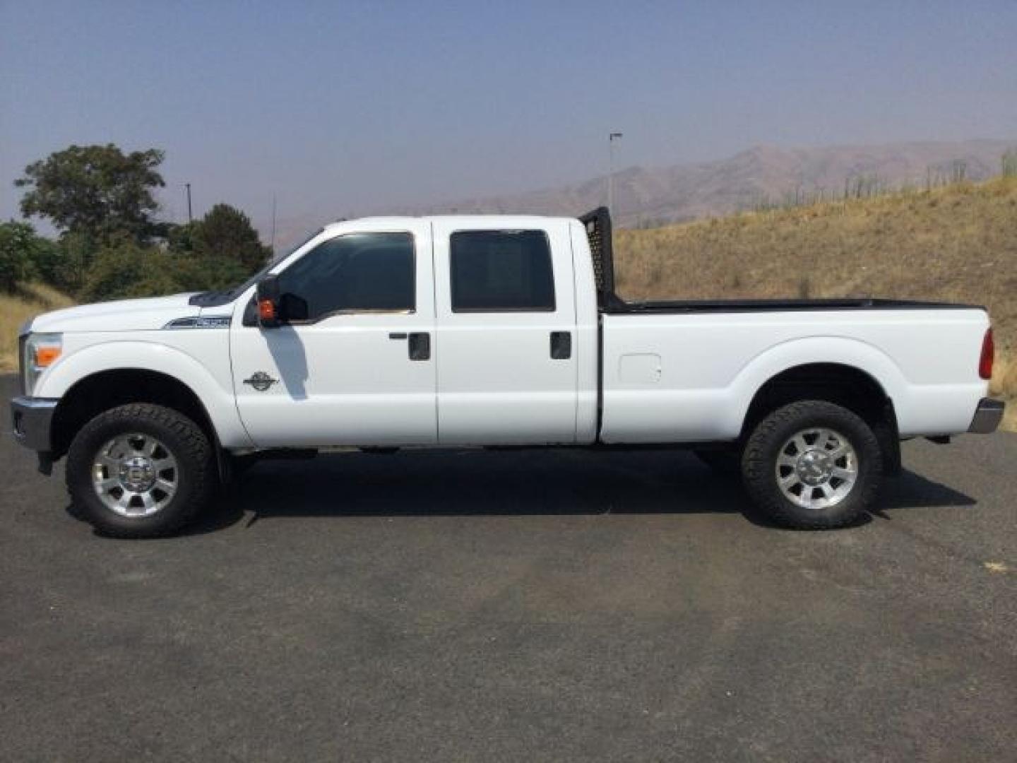 2012 Oxford White /Steel Cloth Interior Ford F-350 SD XLT Crew Cab Long Bed 4WD (1FT8W3BT9CE) with an 6.7L V8 OHV 16V DIESEL engine, 6-Speed Automatic transmission, located at 1801 Main Street, Lewiston, 83501, (208) 743-9371, 46.417065, -117.004799- Photo#2