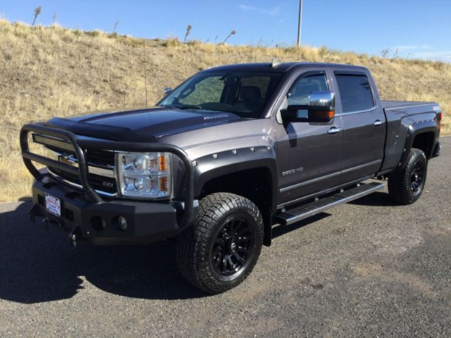 2015 Tungsten Metallic /Jet Black/Dark Ash Chevrolet Silverado 3500HD LTZ Crew Cab 4WD (1GC4K0C80FF) with an 6.6L V8 OHV 32V TURBO DIESEL engine, 6-Speed Automatic transmission, located at 1801 Main Street, Lewiston, 83501, (208) 743-9371, 46.417065, -117.004799- Photo#7