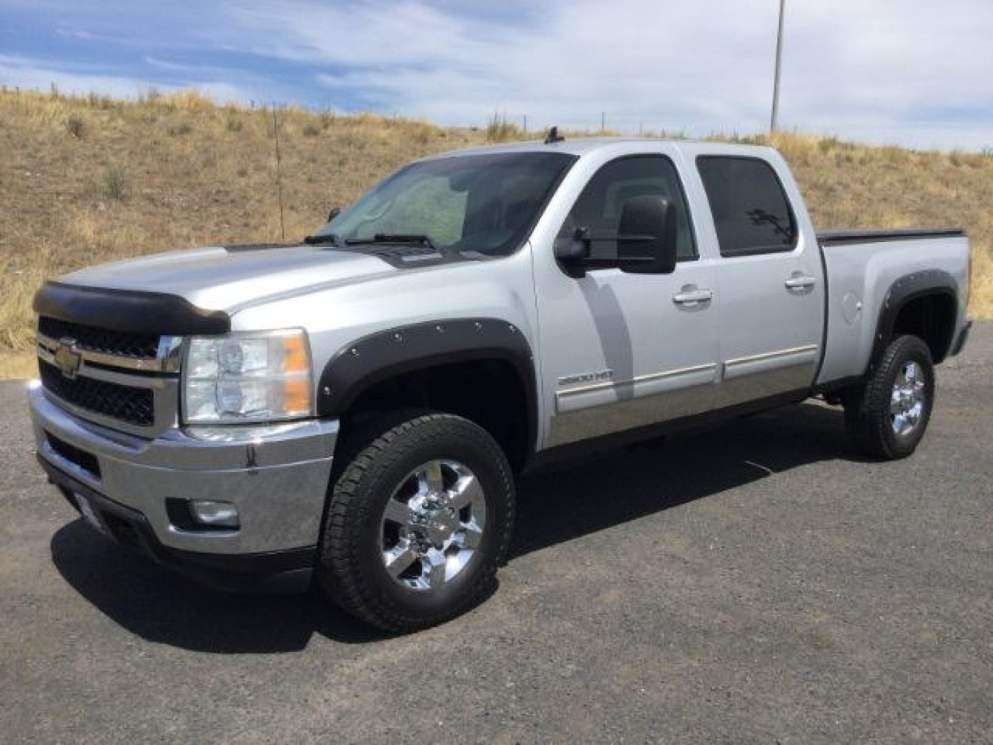2011 Sheer Silver Metallic /Ebony Leather Interior Chevrolet Silverado 3500HD LTZ Crew Cab 4WD (1GC4K1C87BF) with an 6.6L V8 OHV 32V TURBO DIESEL engine, 6-Speed Automatic transmission, located at 1801 Main Street, Lewiston, 83501, (208) 743-9371, 46.417065, -117.004799- Photo#0