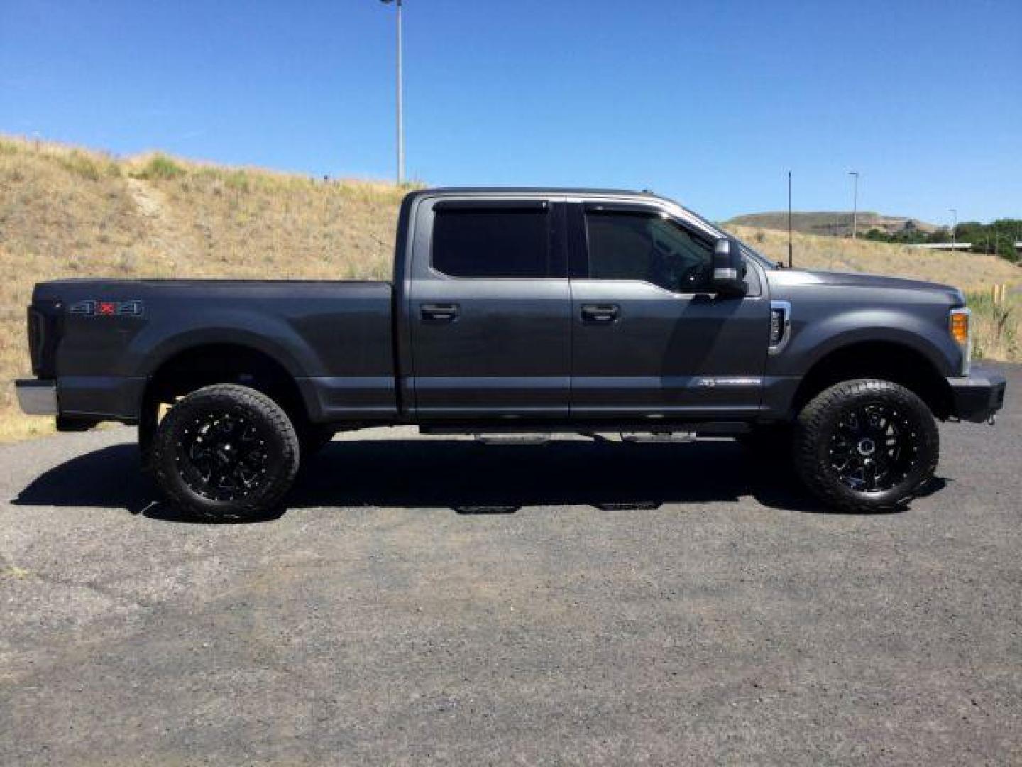 2017 Magnetic Metallic Ford F-250 SD XLT Crew Cab 4WD (1FT7W2BT0HE) with an 6.7L V8 OHV 16V DIESEL engine, 6-Speed Automatic transmission, located at 1801 Main Street, Lewiston, 83501, (208) 743-9371, 46.417065, -117.004799 - Photo#1