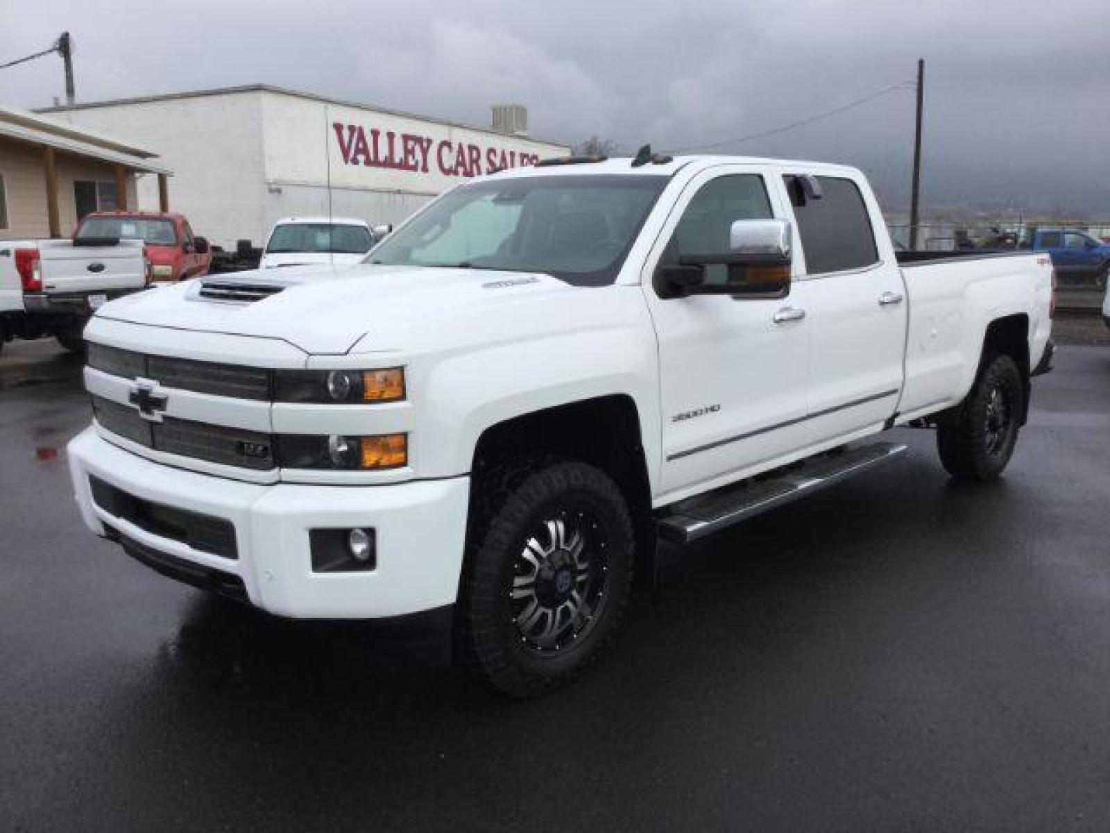2018 Summit White /Jet Black, leather Chevrolet Silverado 3500HD LTZ Crew Cab Long Box 4WD (1GC4K0EY2JF) with an 6.6L V8 OHV 32V TURBO DIESEL engine, 6-Speed Automatic transmission, located at 1801 Main Street, Lewiston, 83501, (208) 743-9371, 46.417065, -117.004799 - Photo #0