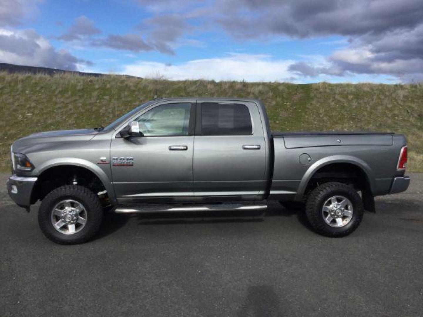 2013 Mineral Gray Metallic CC /Black RAM 2500 Laramie Crew Cab SWB 4WD (3C6UR5FL7DG) with an 6.7L L6 OHV 24V TURBO DIESEL engine, 6-Speed Automatic transmission, located at 1801 Main Street, Lewiston, 83501, (208) 743-9371, 46.417065, -117.004799 - Photo#1