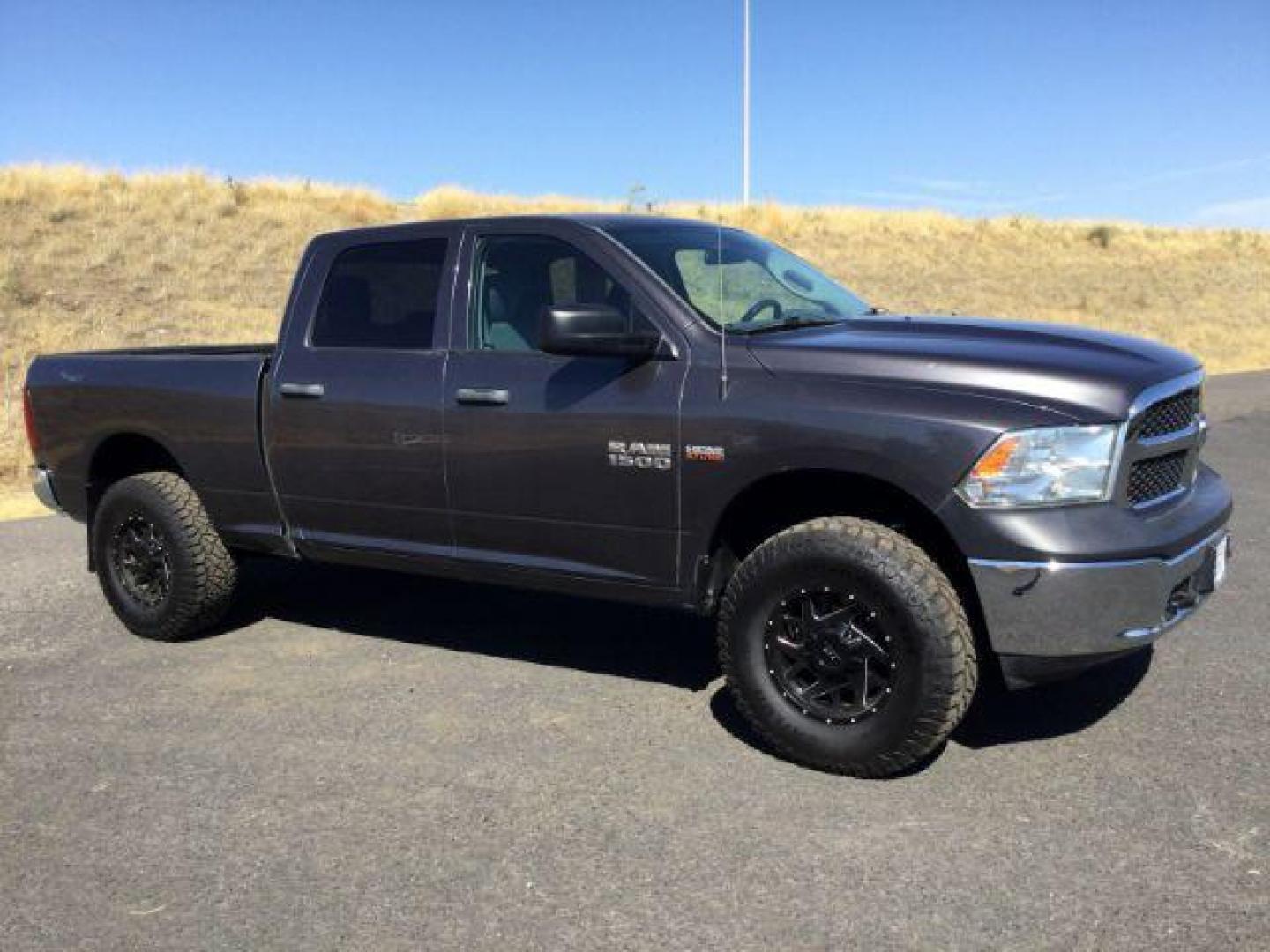2017 Granite Crystal Metallic Clear Coat /Black/Diesel Gray, cloth RAM 1500 Tradesman Crew Cab LWB 4WD (1C6RR7ST9HS) with an 5.7L V8 OHV 16V engine, 8-Speed Automatic transmission, located at 1801 Main Street, Lewiston, 83501, (208) 743-9371, 46.417065, -117.004799 - Photo#0