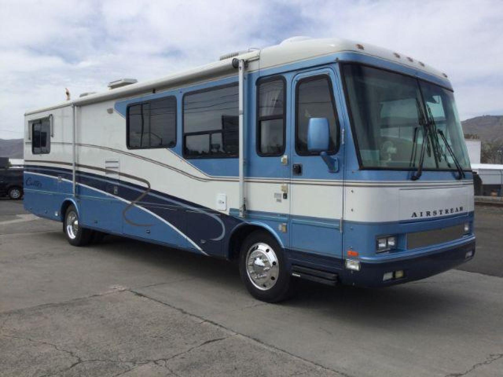 1999 BLUE AIRSTREAM MH Cutter 35ft Diesel (4UZ6XJCAXXC) with an 7.2L L6 DIESEL engine, 6-Speed Automatic transmission, located at 1801 Main Street, Lewiston, 83501, (208) 743-9371, 46.417065, -117.004799 - Recent Maintenance - New Tires, New Batteries, Fuel Filters, Transmission service. - Photo #1