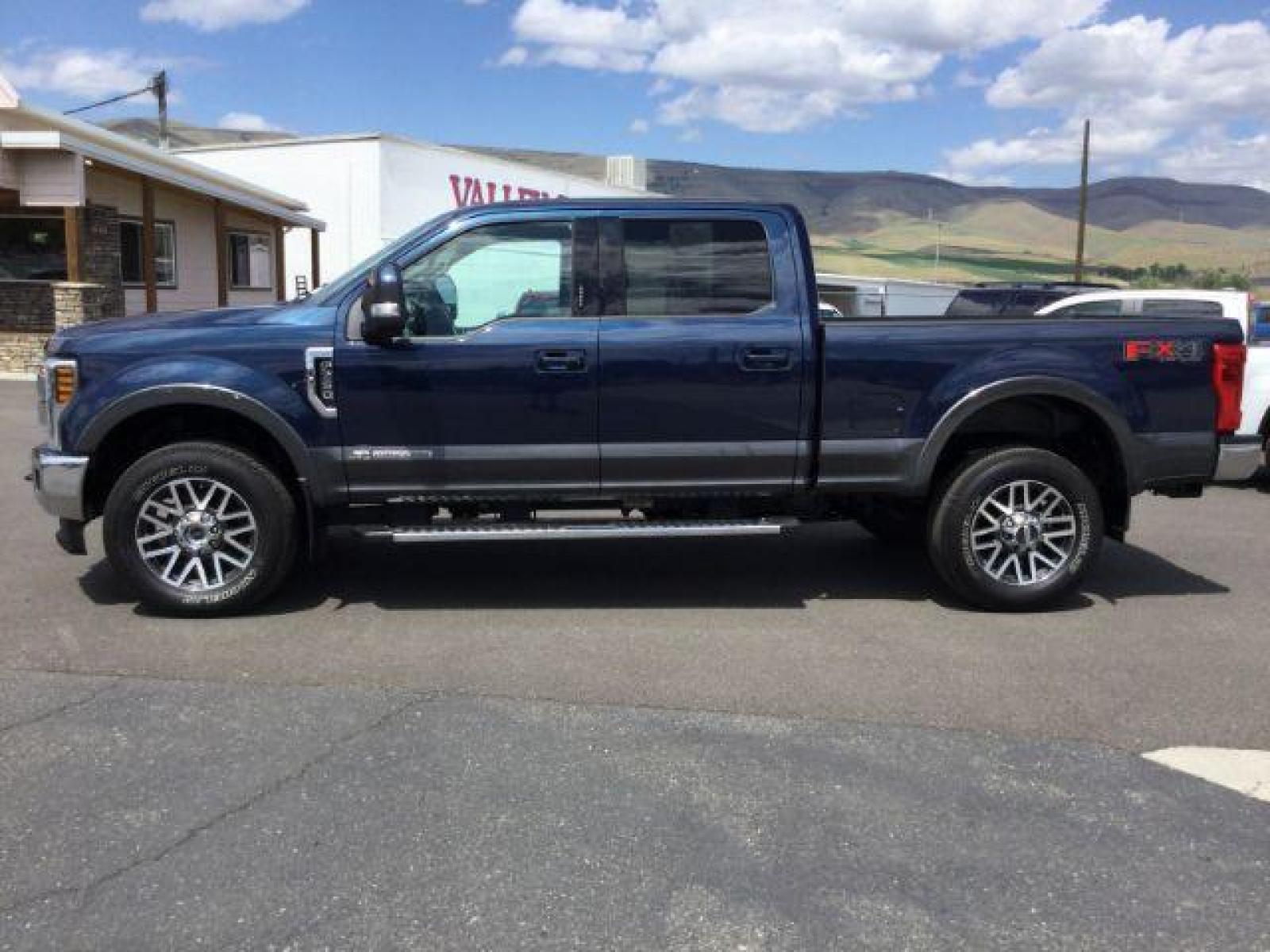 2018 Blue Jeans Metallic/Magnetic Metallic /Black, leather Ford F-350 SD Lariat Crew Cab 4WD (1FT8W3BT0JE) with an 6.7L V8 OHV 16V DIESEL engine, 6-Speed Automatic transmission, located at 1801 Main Street, Lewiston, 83501, (208) 743-9371, 46.417065, -117.004799 - Photo #1