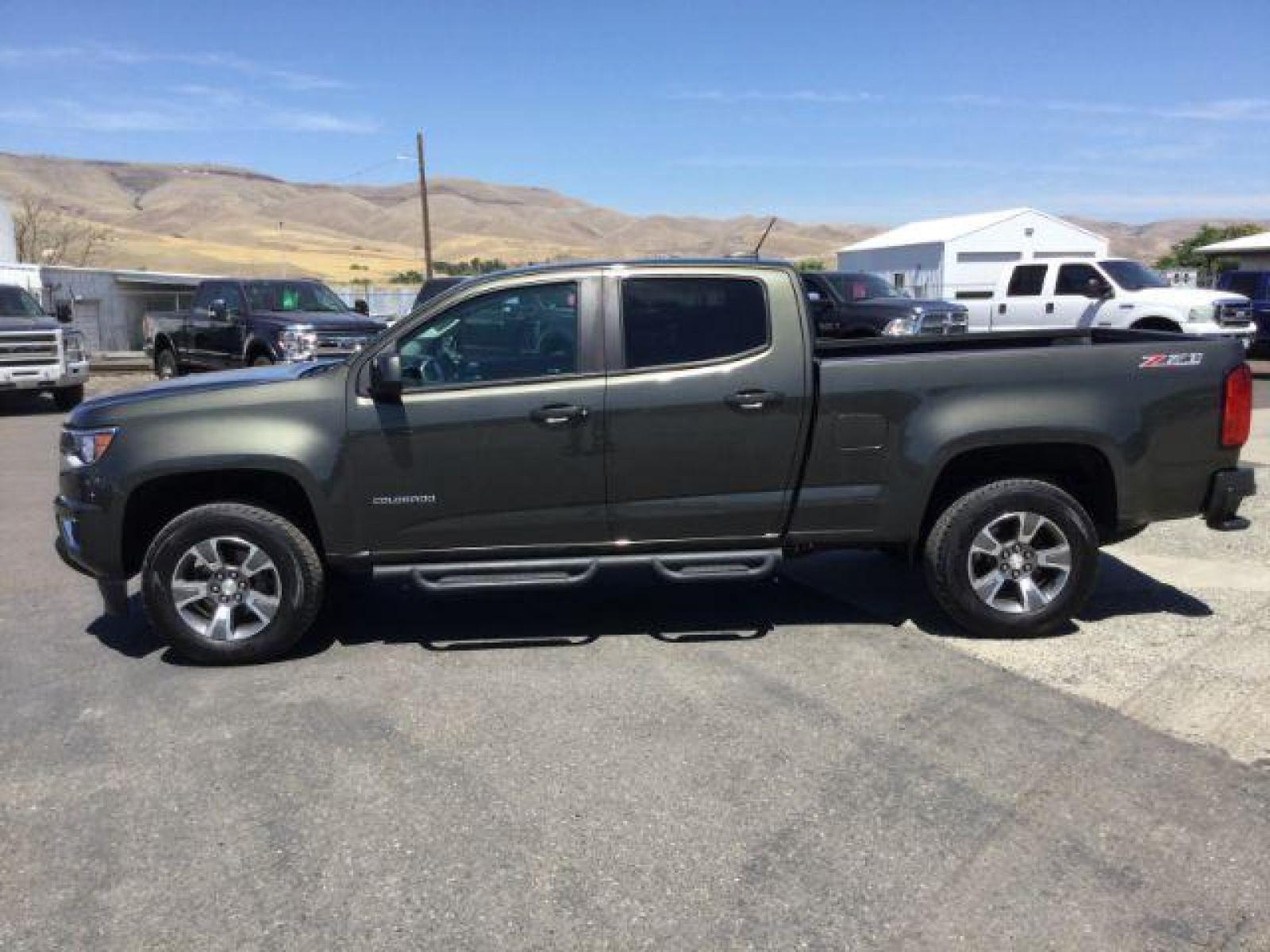 2018 Deepwood Green Metallic /Jet Black, leatherette/cloth Chevrolet Colorado Z71 Crew Cab 4WD Long Box (1GCGTDEN8J1) with an 3.6L V6 DOHC 24V GAS engine, 6-Speed Automatic transmission, located at 1801 Main Street, Lewiston, 83501, (208) 743-9371, 46.417065, -117.004799 - Photo #1