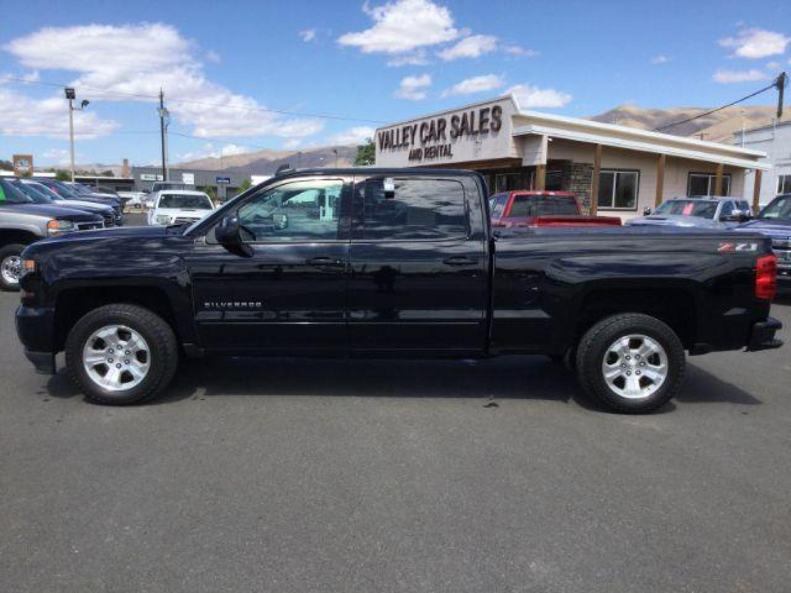 2018 Black /Jet Black, leather Chevrolet Silverado 1500 LT Crew Cab Long Box 4WD (1GCUKREC9JF) with an 5.3L V8 OHV 16V engine, 6-Speed Automatic transmission, located at 1801 Main Street, Lewiston, 83501, (208) 743-9371, 46.417065, -117.004799 - Photo #1