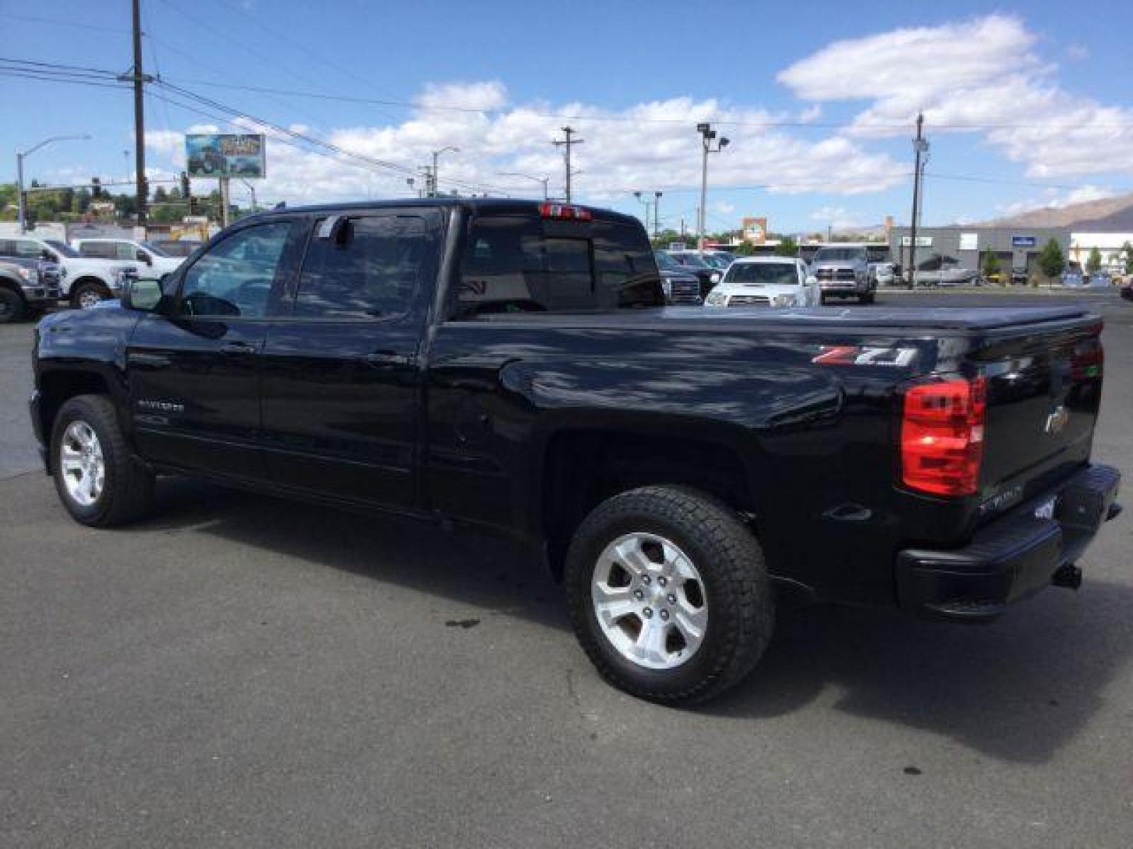 2018 Black /Jet Black, leather Chevrolet Silverado 1500 LT Crew Cab Long Box 4WD (1GCUKREC9JF) with an 5.3L V8 OHV 16V engine, 6-Speed Automatic transmission, located at 1801 Main Street, Lewiston, 83501, (208) 743-9371, 46.417065, -117.004799 - Photo #2