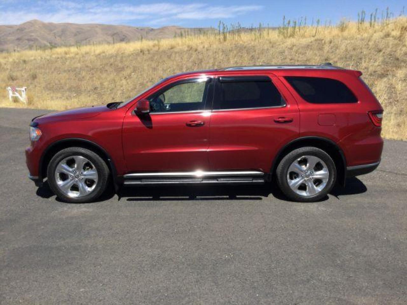 2014 Dp Cherry Red Crystal PC /Black Dodge Durango Limited AWD (1C4RDJDG8EC) with an 3.6L V6 DOHC 24V engine, 8-Speed Automatic transmission, located at 1801 Main Street, Lewiston, 83501, (208) 743-9371, 46.417065, -117.004799 - Photo #1