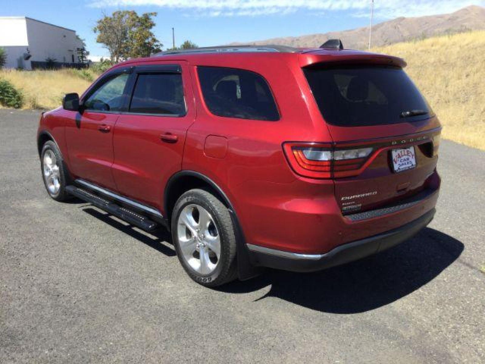 2014 Dp Cherry Red Crystal PC /Black Dodge Durango Limited AWD (1C4RDJDG8EC) with an 3.6L V6 DOHC 24V engine, 8-Speed Automatic transmission, located at 1801 Main Street, Lewiston, 83501, (208) 743-9371, 46.417065, -117.004799 - Photo #2