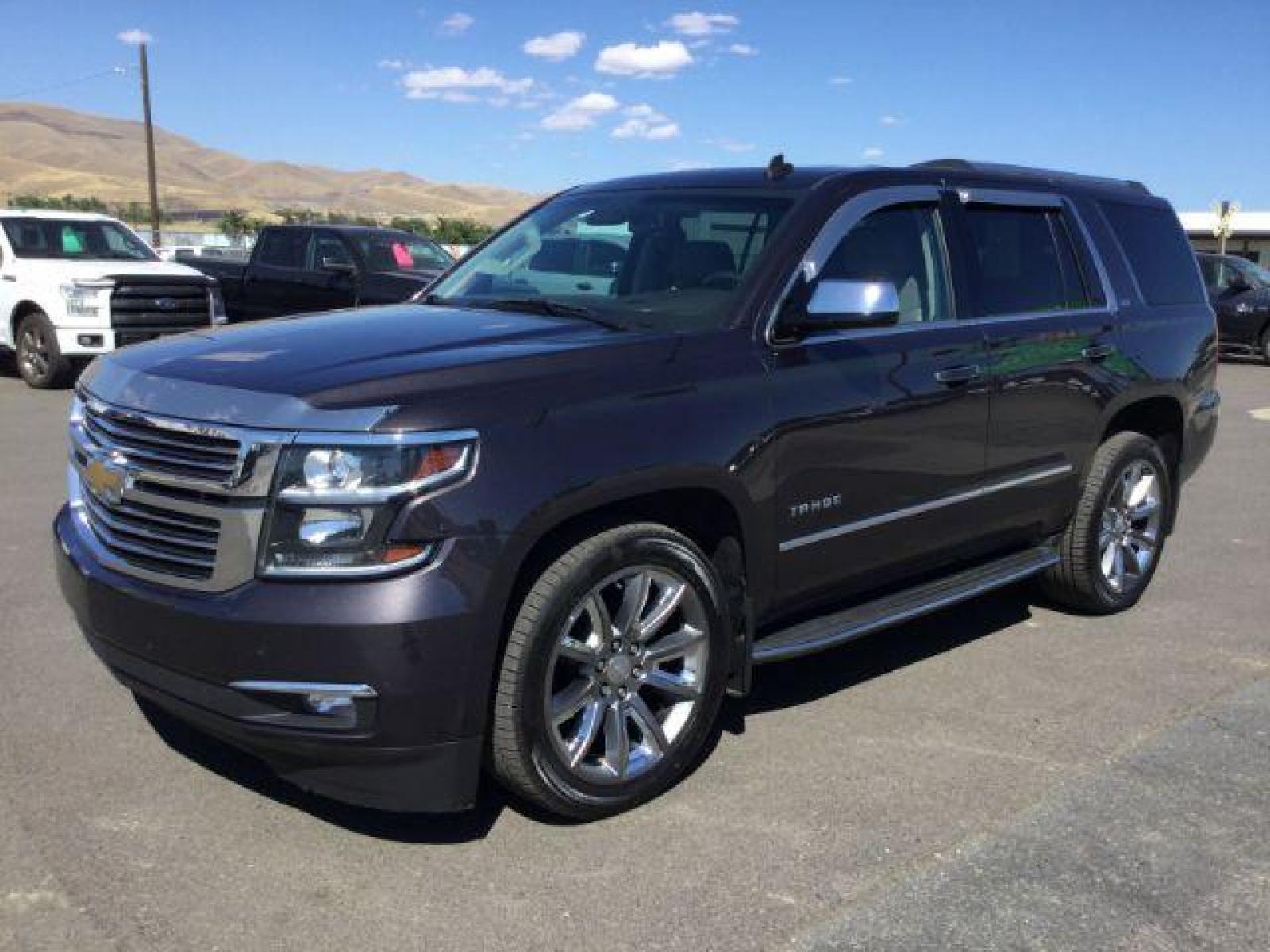 2015 GRAY /Medium Brown Leather Chevrolet Tahoe LTZ 4WD (1GNSKCKC8FR) with an 5.3L V8 OHV 16V engine, 6-Speed Automatic transmission, located at 1801 Main Street, Lewiston, 83501, (208) 743-9371, 46.417065, -117.004799 - Photo #0