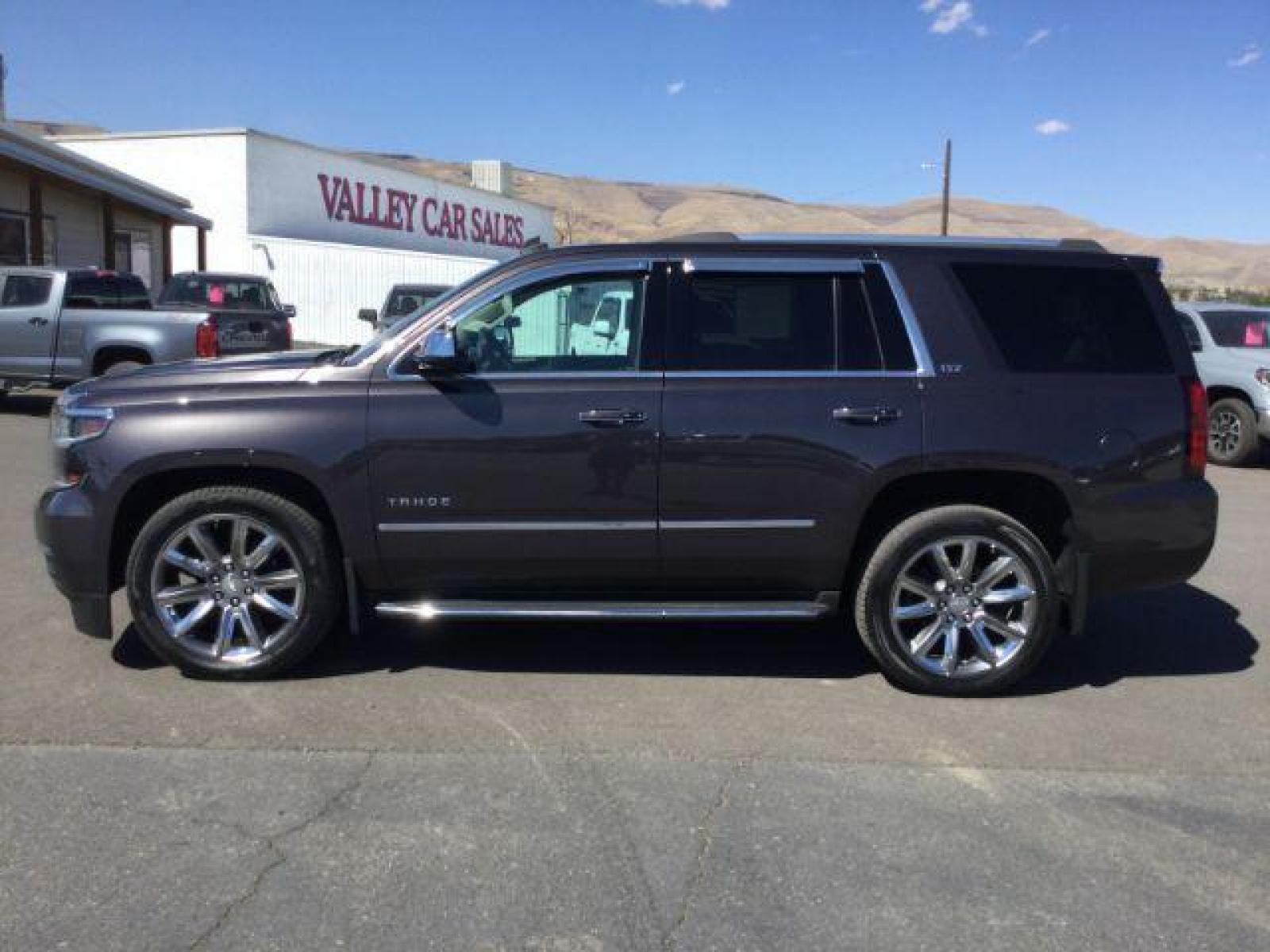 2015 GRAY /Medium Brown Leather Chevrolet Tahoe LTZ 4WD (1GNSKCKC8FR) with an 5.3L V8 OHV 16V engine, 6-Speed Automatic transmission, located at 1801 Main Street, Lewiston, 83501, (208) 743-9371, 46.417065, -117.004799 - Photo #1