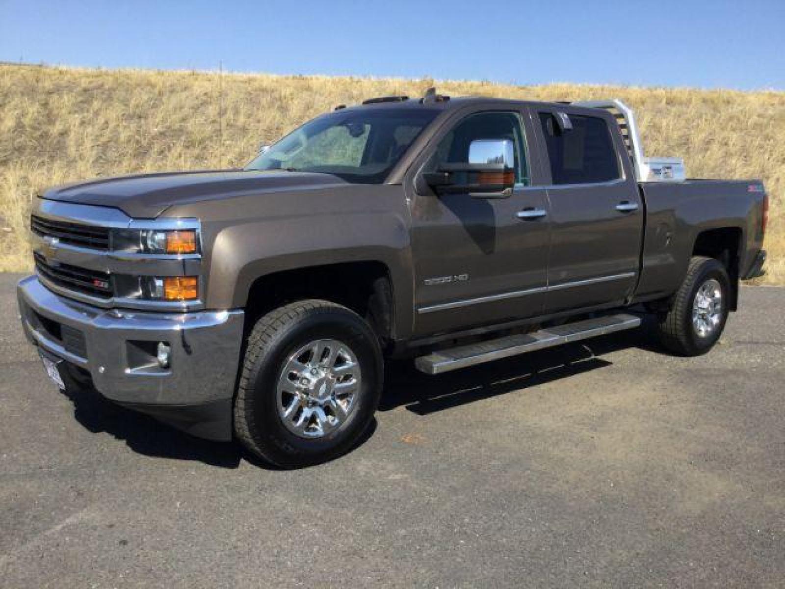 2015 Brownstone Metallic /Cocoa/Dune Chevrolet Silverado 3500HD LTZ Crew Cab 4WD (1GC1K0EG6FF) with an 6.0L V8 OHV 16V FFV engine, 6-Speed Automatic transmission, located at 1801 Main Street, Lewiston, 83501, (208) 743-9371, 46.417065, -117.004799 - Photo #0