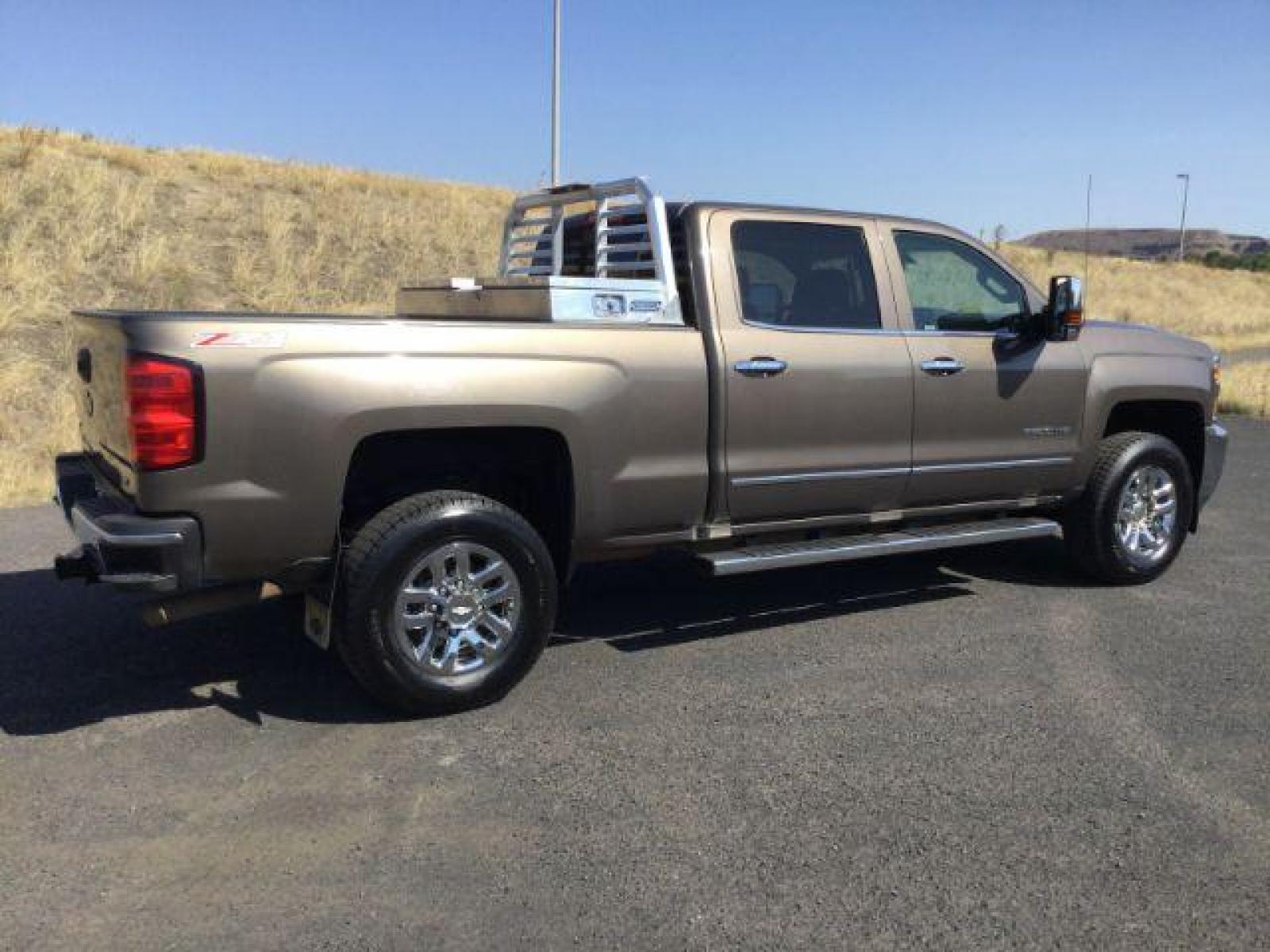 2015 Brownstone Metallic /Cocoa/Dune Chevrolet Silverado 3500HD LTZ Crew Cab 4WD (1GC1K0EG6FF) with an 6.0L V8 OHV 16V FFV engine, 6-Speed Automatic transmission, located at 1801 Main Street, Lewiston, 83501, (208) 743-9371, 46.417065, -117.004799 - Photo #9