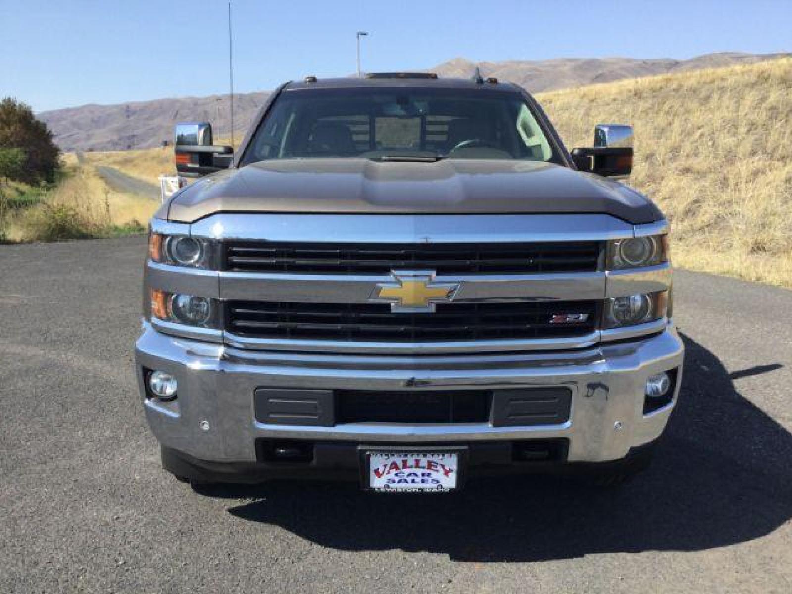 2015 Brownstone Metallic /Cocoa/Dune Chevrolet Silverado 3500HD LTZ Crew Cab 4WD (1GC1K0EG6FF) with an 6.0L V8 OHV 16V FFV engine, 6-Speed Automatic transmission, located at 1801 Main Street, Lewiston, 83501, (208) 743-9371, 46.417065, -117.004799 - Photo #6