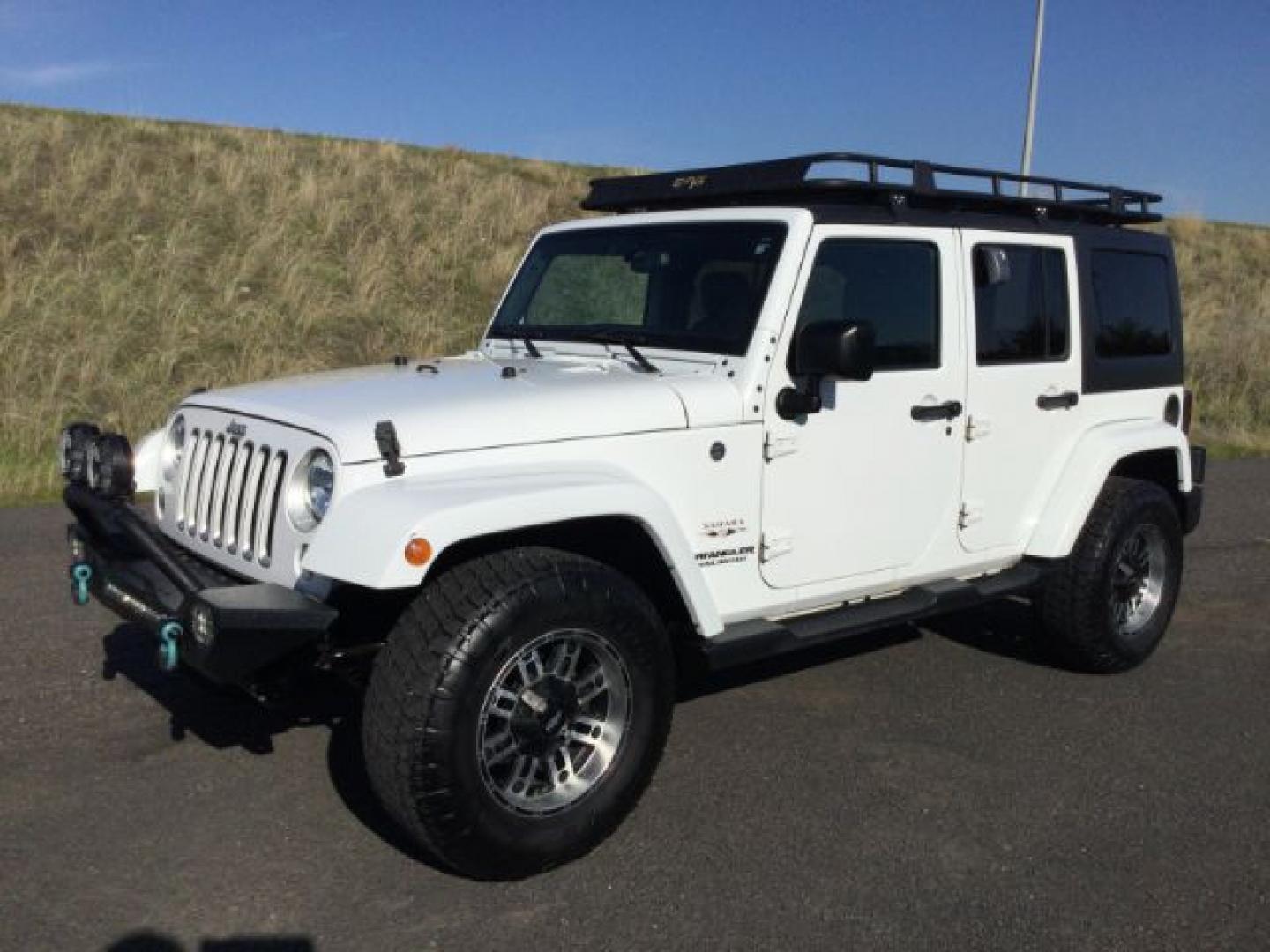 2016 Bright White Clear Coat /Black, leather Jeep Wrangler Unlimited Sahara 4WD (1C4BJWEG3GL) with an 3.6L V6 DOHC 24V FFV engine, 5-Speed Automatic transmission, located at 1801 Main Street, Lewiston, 83501, (208) 743-9371, 46.417065, -117.004799- Photo#0