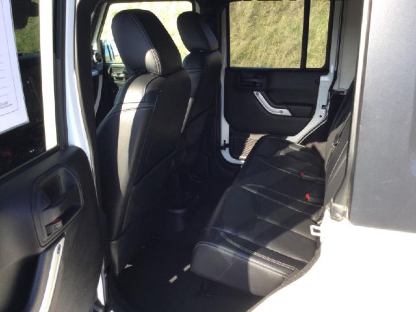 2016 Bright White Clear Coat /Black, leather Jeep Wrangler Unlimited Sahara 4WD (1C4BJWEG3GL) with an 3.6L V6 DOHC 24V FFV engine, 5-Speed Automatic transmission, located at 1801 Main Street, Lewiston, 83501, (208) 743-9371, 46.417065, -117.004799- Photo#7