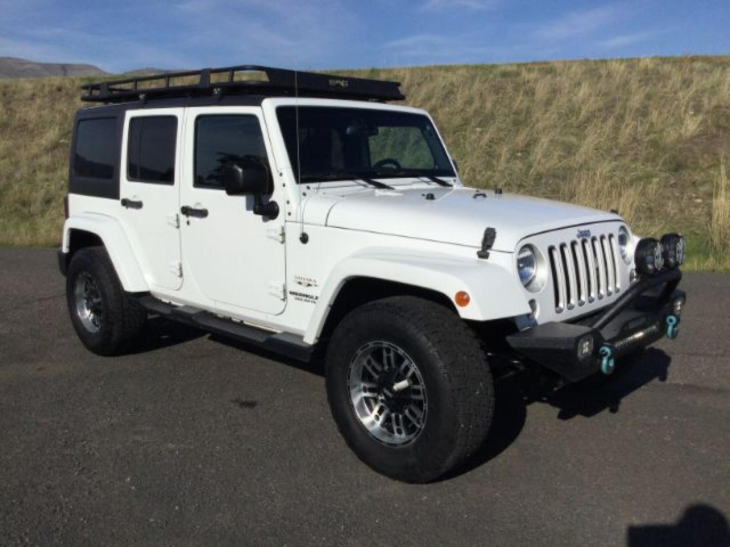 2016 Bright White Clear Coat /Black, leather Jeep Wrangler Unlimited Sahara 4WD (1C4BJWEG3GL) with an 3.6L V6 DOHC 24V FFV engine, 5-Speed Automatic transmission, located at 1801 Main Street, Lewiston, 83501, (208) 743-9371, 46.417065, -117.004799- Photo#14