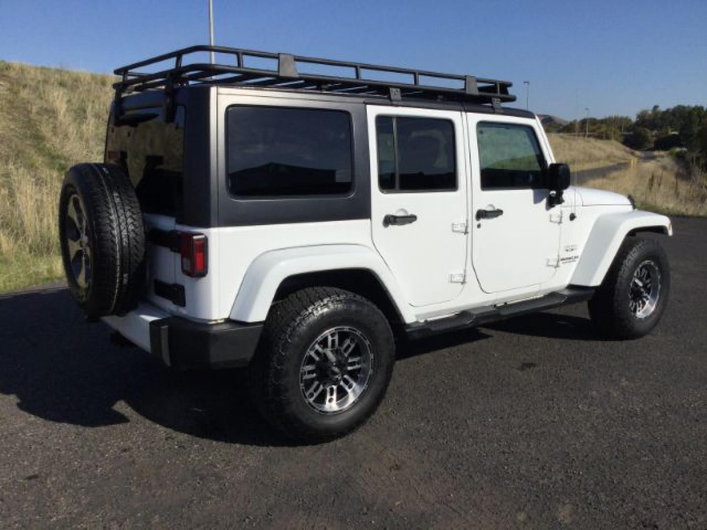 2016 Bright White Clear Coat /Black, leather Jeep Wrangler Unlimited Sahara 4WD (1C4BJWEG3GL) with an 3.6L V6 DOHC 24V FFV engine, 5-Speed Automatic transmission, located at 1801 Main Street, Lewiston, 83501, (208) 743-9371, 46.417065, -117.004799- Photo#17