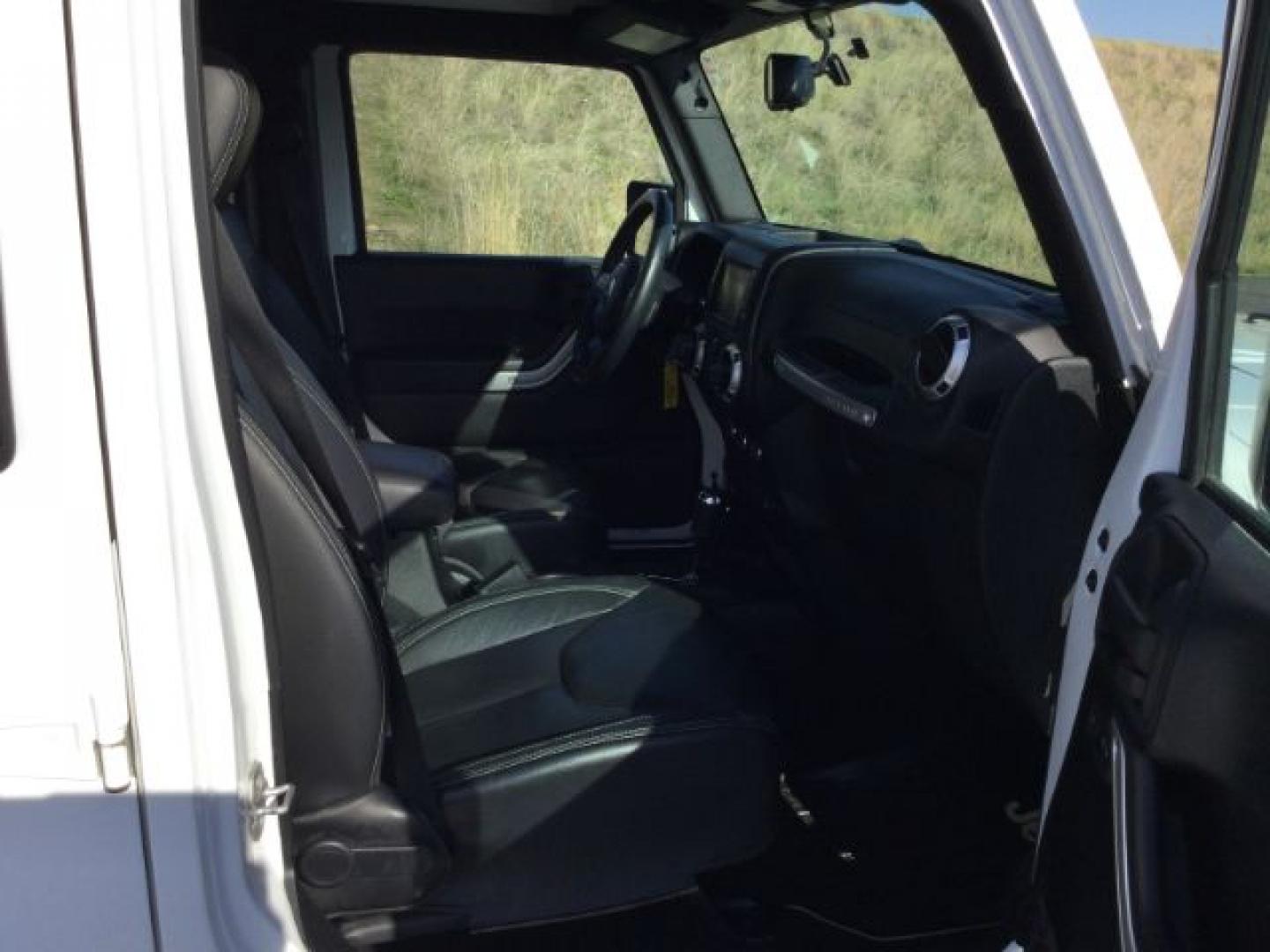 2016 Bright White Clear Coat /Black, leather Jeep Wrangler Unlimited Sahara 4WD (1C4BJWEG3GL) with an 3.6L V6 DOHC 24V FFV engine, 5-Speed Automatic transmission, located at 1801 Main Street, Lewiston, 83501, (208) 743-9371, 46.417065, -117.004799- Photo#19