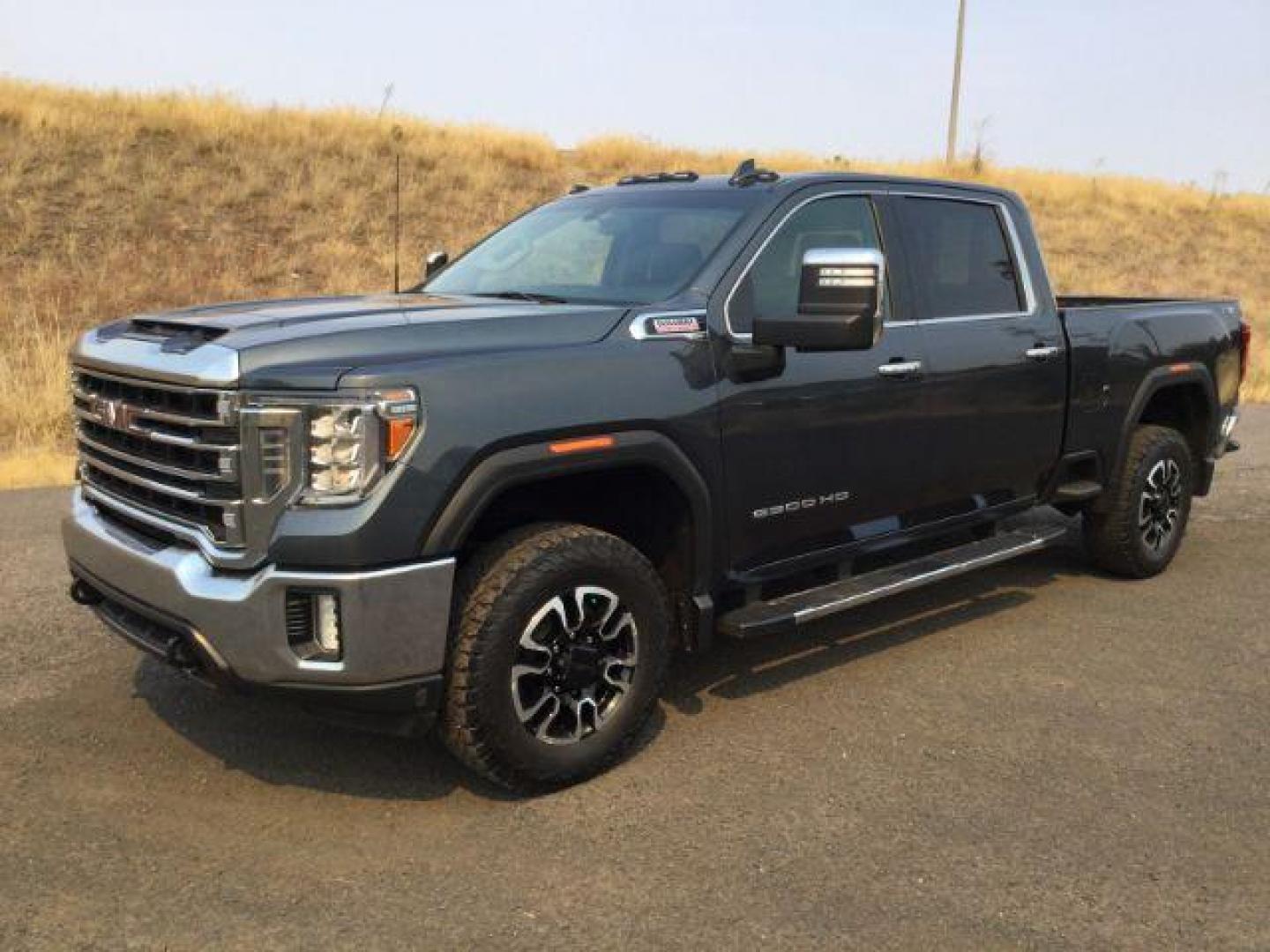 2020 Dark Sky Metallic /Jet Black, leather GMC Sierra 2500HD SLT Crew Cab 4WD (1GT49NEY1LF) with an 6.6L V8 OHV 16 DIESEL engine, 10-speed automatic transmission, located at 1801 Main Street, Lewiston, 83501, (208) 743-9371, 46.417065, -117.004799 - Photo#0