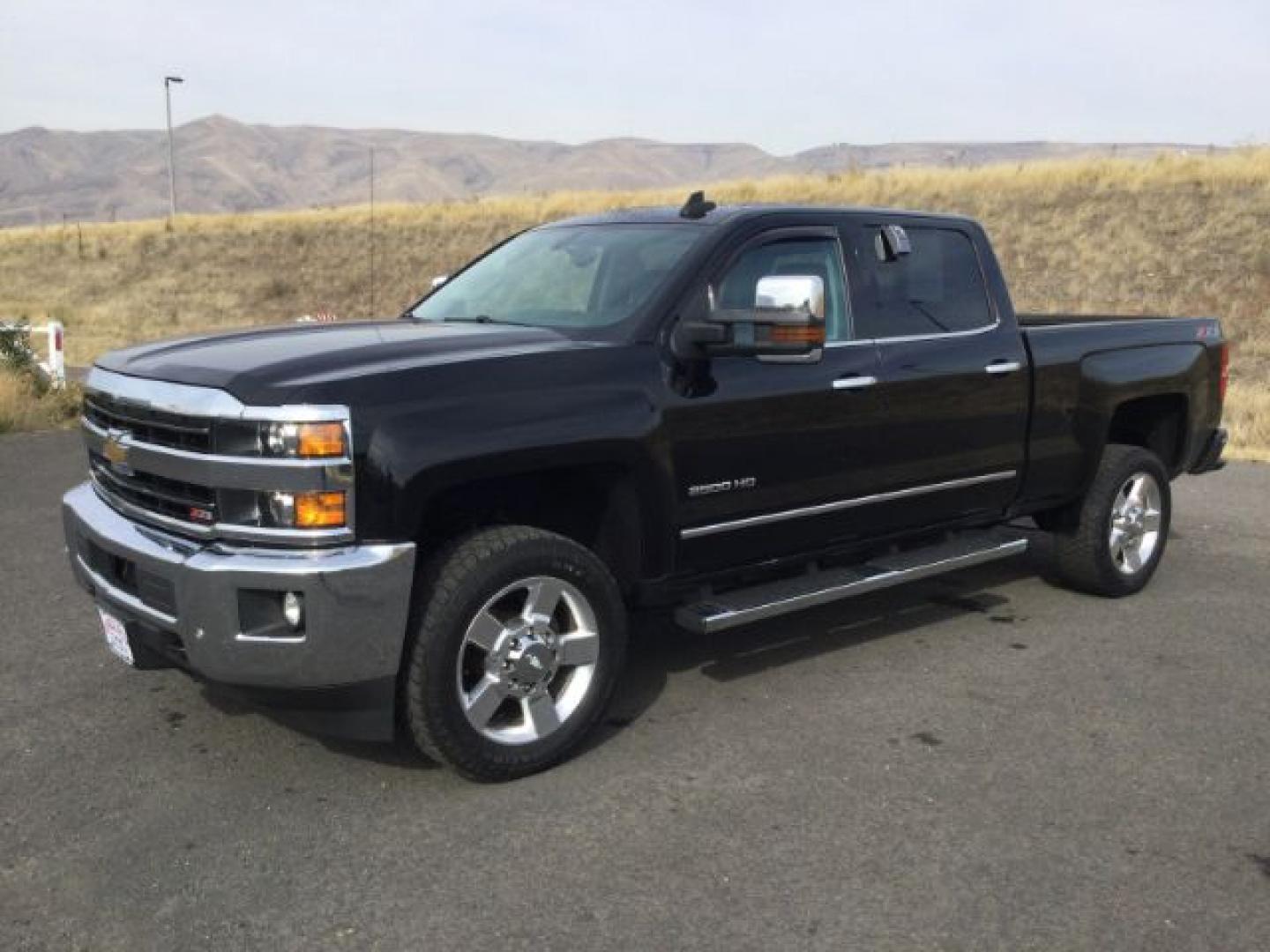 2018 Black /Jet Black, leather Chevrolet Silverado 2500HD LTZ Crew Cab 4WD (1GC1KWEG9JF) with an 6.0L V8 OHV 16V FFV engine, 6-Speed Automatic transmission, located at 1801 Main Street, Lewiston, 83501, (208) 743-9371, 46.417065, -117.004799- Photo#0