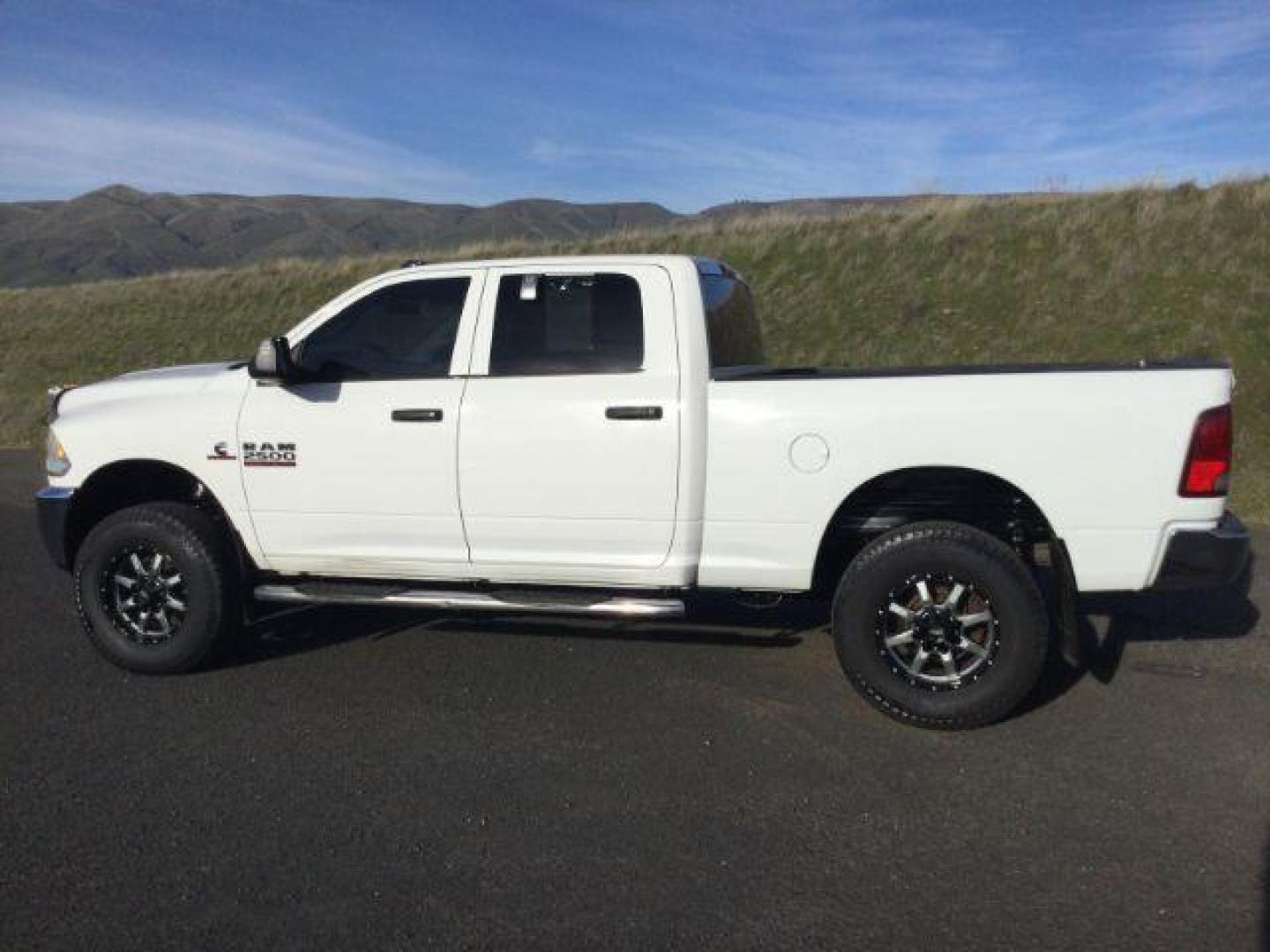 2018 Bright White Clear Coat /Black/Diesel Gray, cloth RAM 2500 Tradesman Crew Cab SWB 4WD (3C6UR5CL4JG) with an 6.7L L6 OHV 24V TURBO DIESEL engine, 6-Speed Automatic transmission, located at 1801 Main Street, Lewiston, 83501, (208) 743-9371, 46.417065, -117.004799 - Photo#1