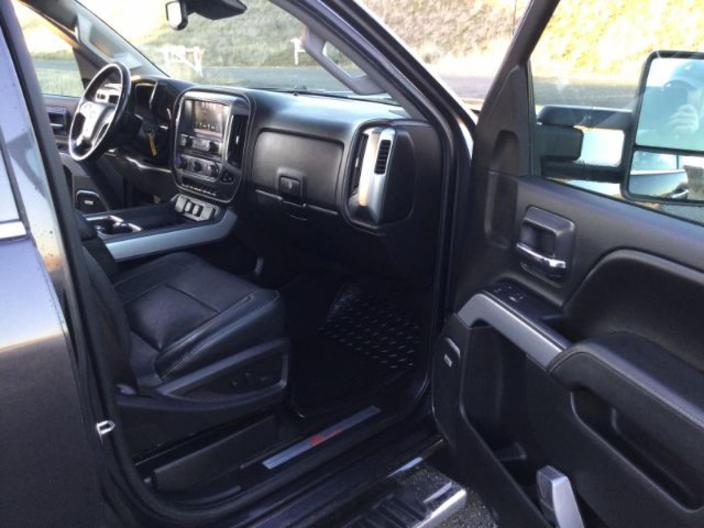 2016 Graystone Metallic /Black Leather Chevrolet Silverado 3500HD LTZ CREW CAB 4X4 (1GC4K0E85GF) with an Duramax 6.6L V-8 diesel direct injection engine, 6-Speed Automatic transmission, located at 1801 Main Street, Lewiston, 83501, (208) 743-9371, 46.417065, -117.004799- Photo#9