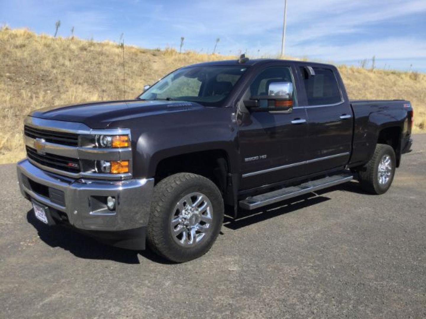 2016 Graystone Metallic /Black Leather Chevrolet Silverado 3500HD LTZ CREW CAB 4X4 (1GC4K0E85GF) with an Duramax 6.6L V-8 diesel direct injection engine, 6-Speed Automatic transmission, located at 1801 Main Street, Lewiston, 83501, (208) 743-9371, 46.417065, -117.004799- Photo#0