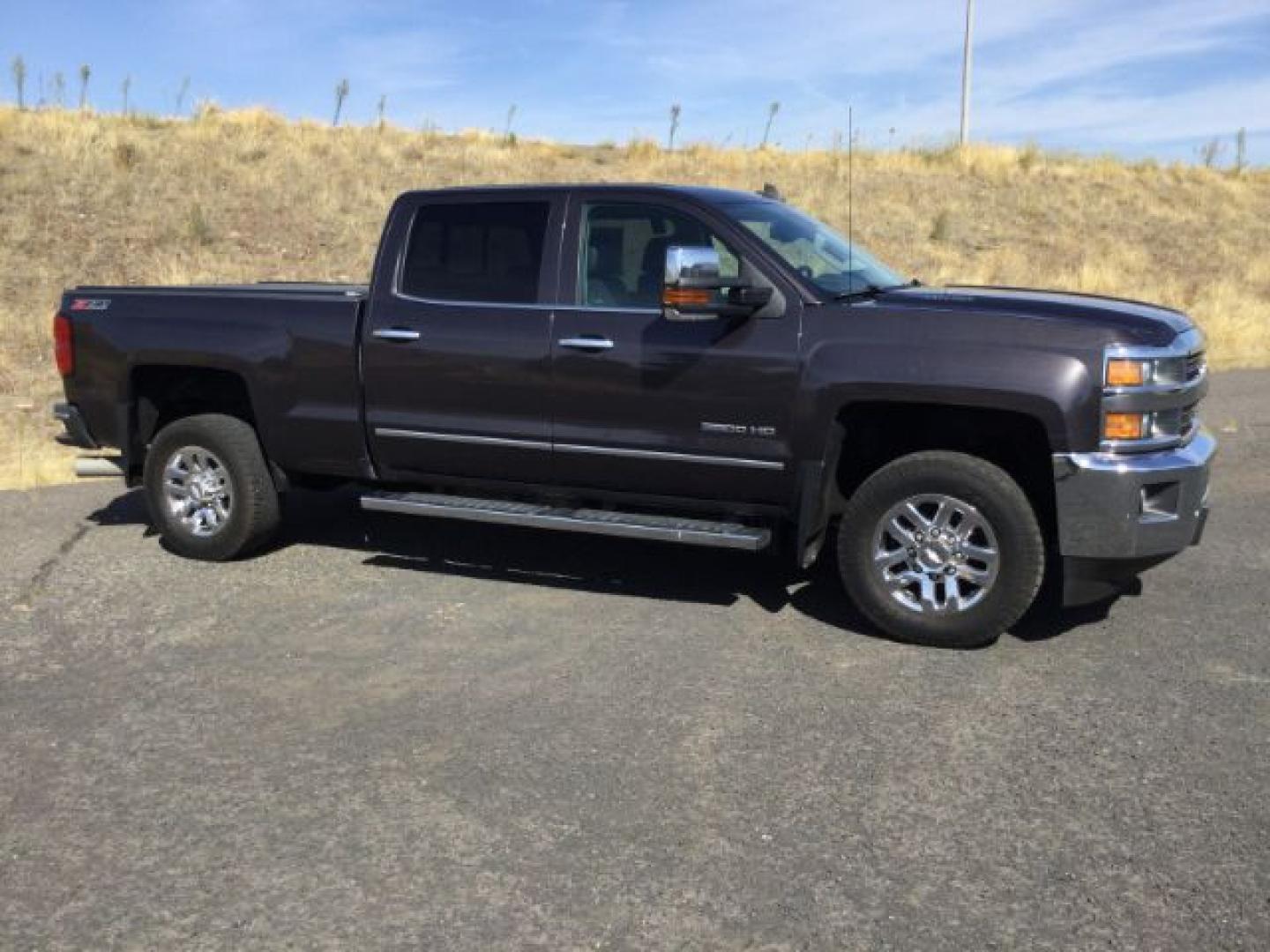 2016 Graystone Metallic /Black Leather Chevrolet Silverado 3500HD LTZ CREW CAB 4X4 (1GC4K0E85GF) with an Duramax 6.6L V-8 diesel direct injection engine, 6-Speed Automatic transmission, located at 1801 Main Street, Lewiston, 83501, (208) 743-9371, 46.417065, -117.004799- Photo#2