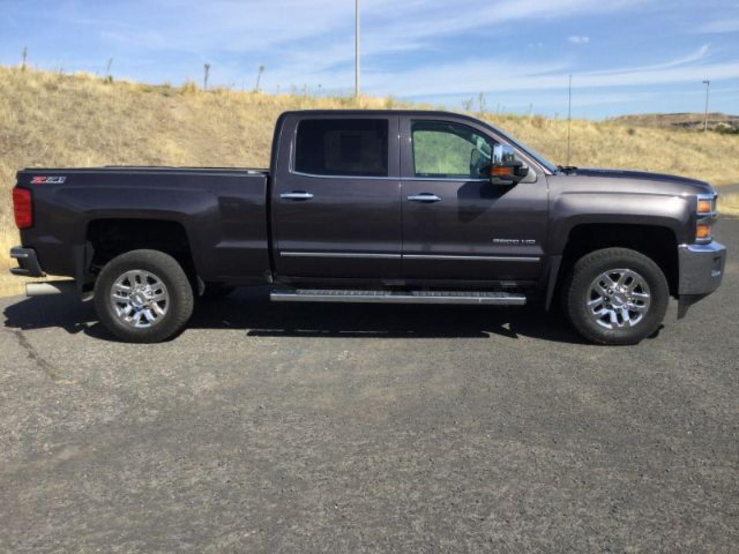 2016 Graystone Metallic /Black Leather Chevrolet Silverado 3500HD LTZ CREW CAB 4X4 (1GC4K0E85GF) with an Duramax 6.6L V-8 diesel direct injection engine, 6-Speed Automatic transmission, located at 1801 Main Street, Lewiston, 83501, (208) 743-9371, 46.417065, -117.004799- Photo#10