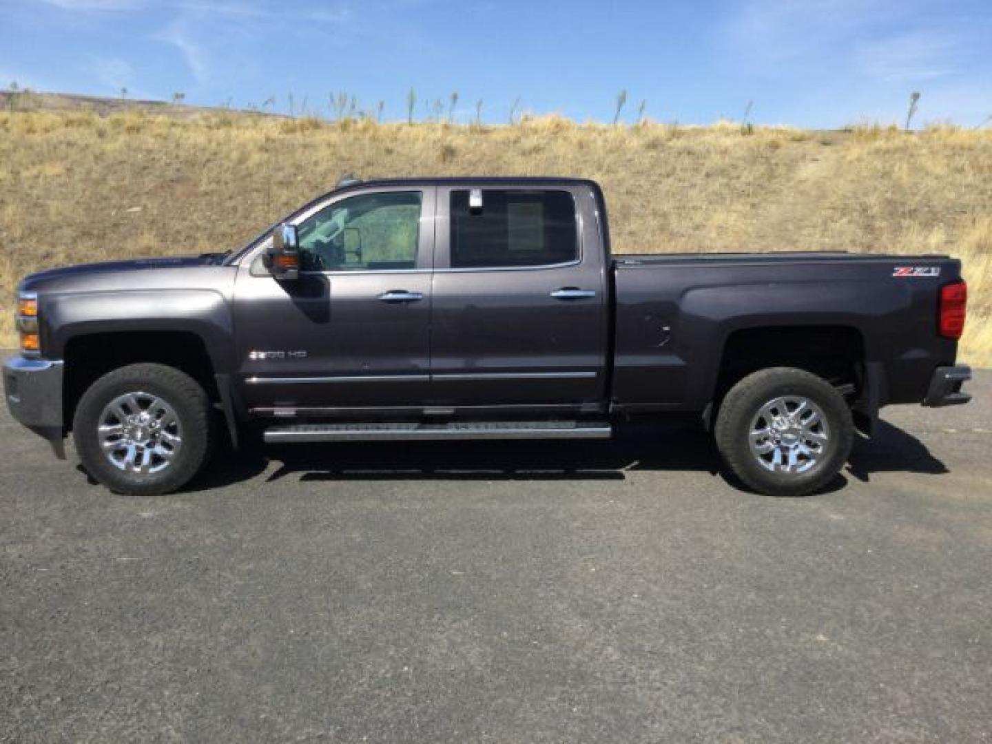 2016 Graystone Metallic /Black Leather Chevrolet Silverado 3500HD LTZ CREW CAB 4X4 (1GC4K0E85GF) with an Duramax 6.6L V-8 diesel direct injection engine, 6-Speed Automatic transmission, located at 1801 Main Street, Lewiston, 83501, (208) 743-9371, 46.417065, -117.004799- Photo#12