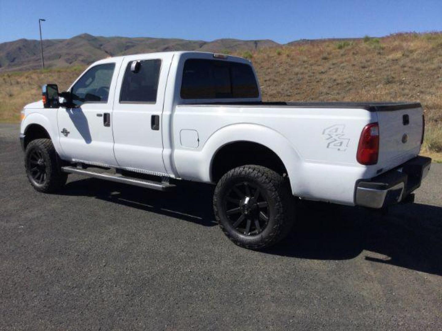 2011 Oxford White /Gray Cloth Ford F 250 Crew Cab 4x4 XLT (1FT7W2BTXBE) with an Powerstroke 6.7L V-8 diesel direct injection engine, 6-SPEED AUTOMATIC transmission, located at 1801 Main Street, Lewiston, 83501, (208) 743-9371, 46.417065, -117.004799 - Photo#7