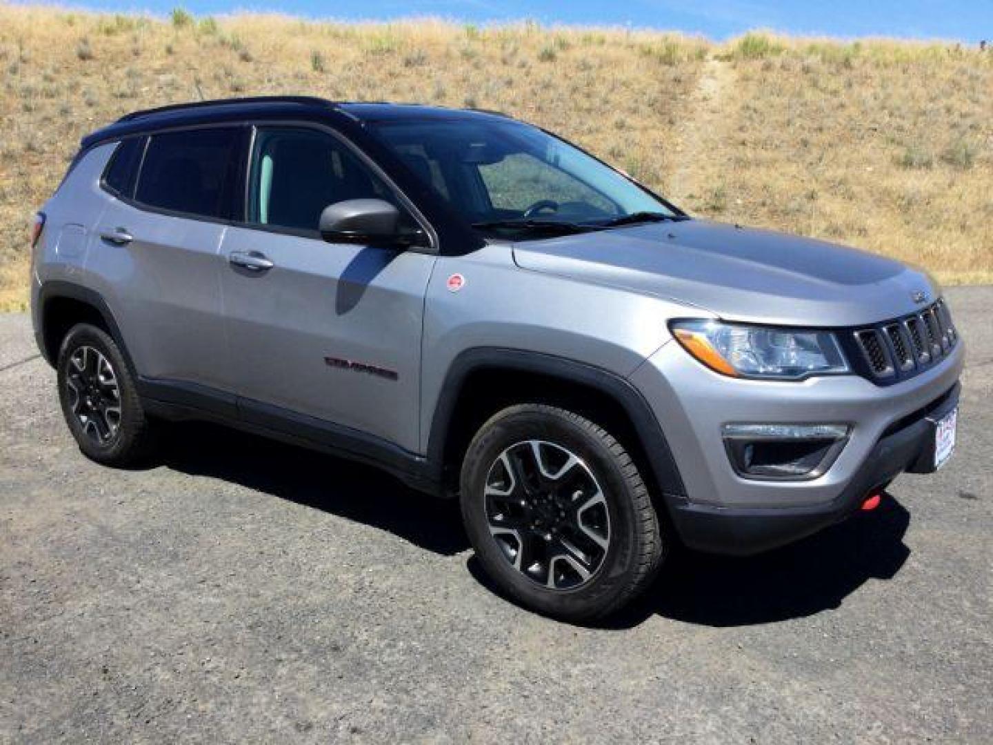 2020 Billet Silver Metallic Clearcoat /Ruby Red/Black Jeep Compass Trailhawk 4X4 (3C4NJDDB2LT) with an 2.4L I-4 variable valve control engine, 9 Speed Automatic transmission, located at 1801 Main Street, Lewiston, 83501, (208) 743-9371, 46.417065, -117.004799 - Photo#0