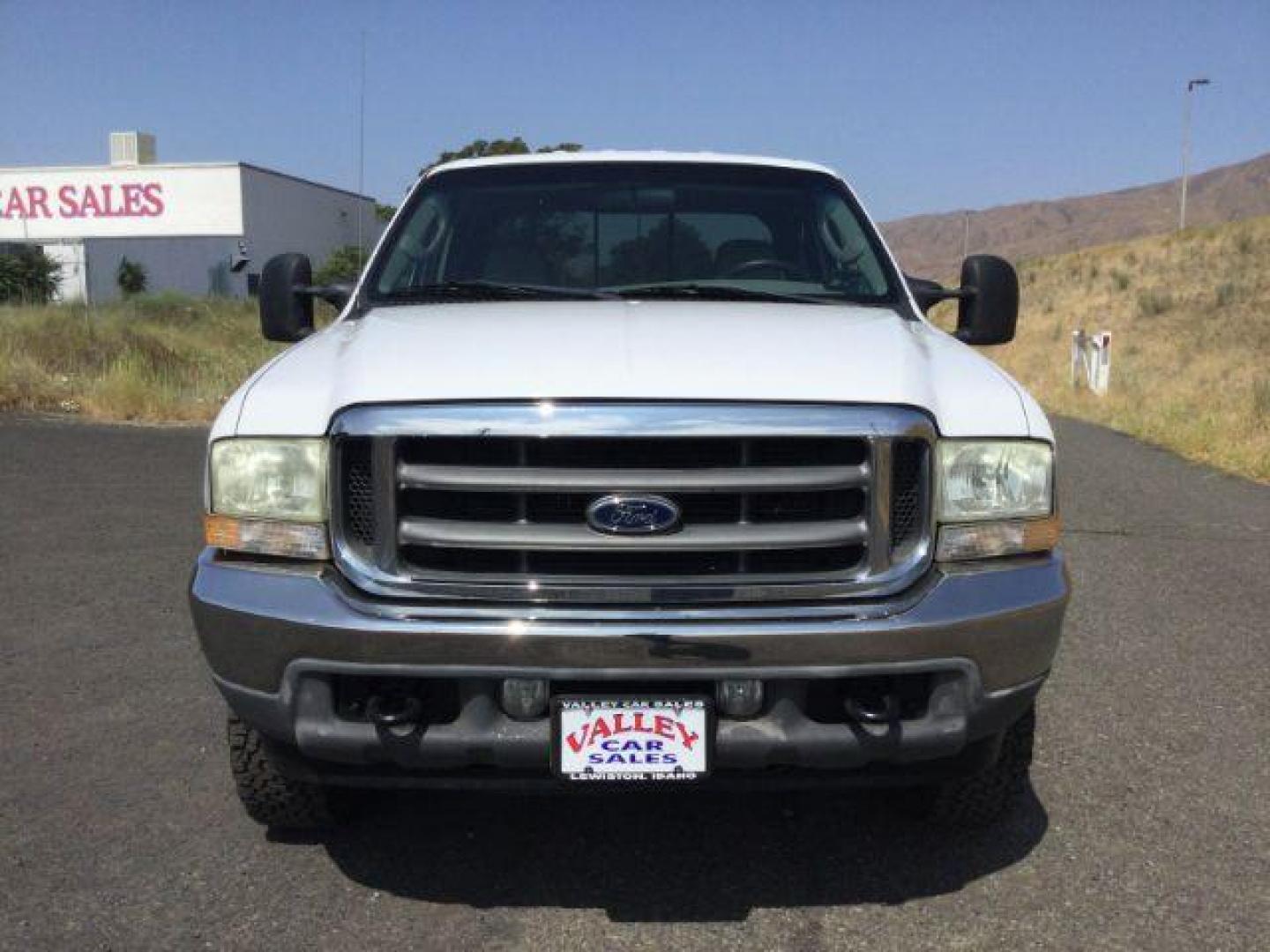 2004 Oxford White Clearcoat /Medium Flint Ford F-350 Lariat Crew Cab Long Bed 4WD (1FTSW31P74E) with an Powerstroke 6L V-8 diesel direct injection engine, 5-Speed Automatic transmission, located at 1801 Main Street, Lewiston, 83501, (208) 743-9371, 46.417065, -117.004799 - Photo#16
