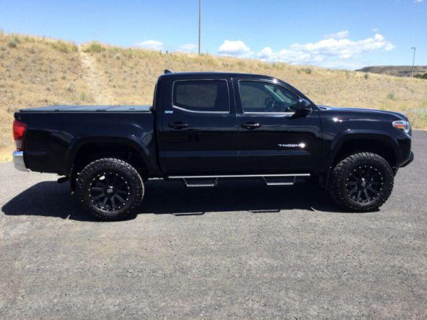 2017 Black /Cement Gray Toyota Tacoma SR5 V6 Crew Cab 4x4 (3TMCZ5AN4HM) with an 3.5L V-6 port/direct injection engine, 6-Speed Automatic transmission, located at 1801 Main Street, Lewiston, 83501, (208) 743-9371, 46.417065, -117.004799 - Photo#2
