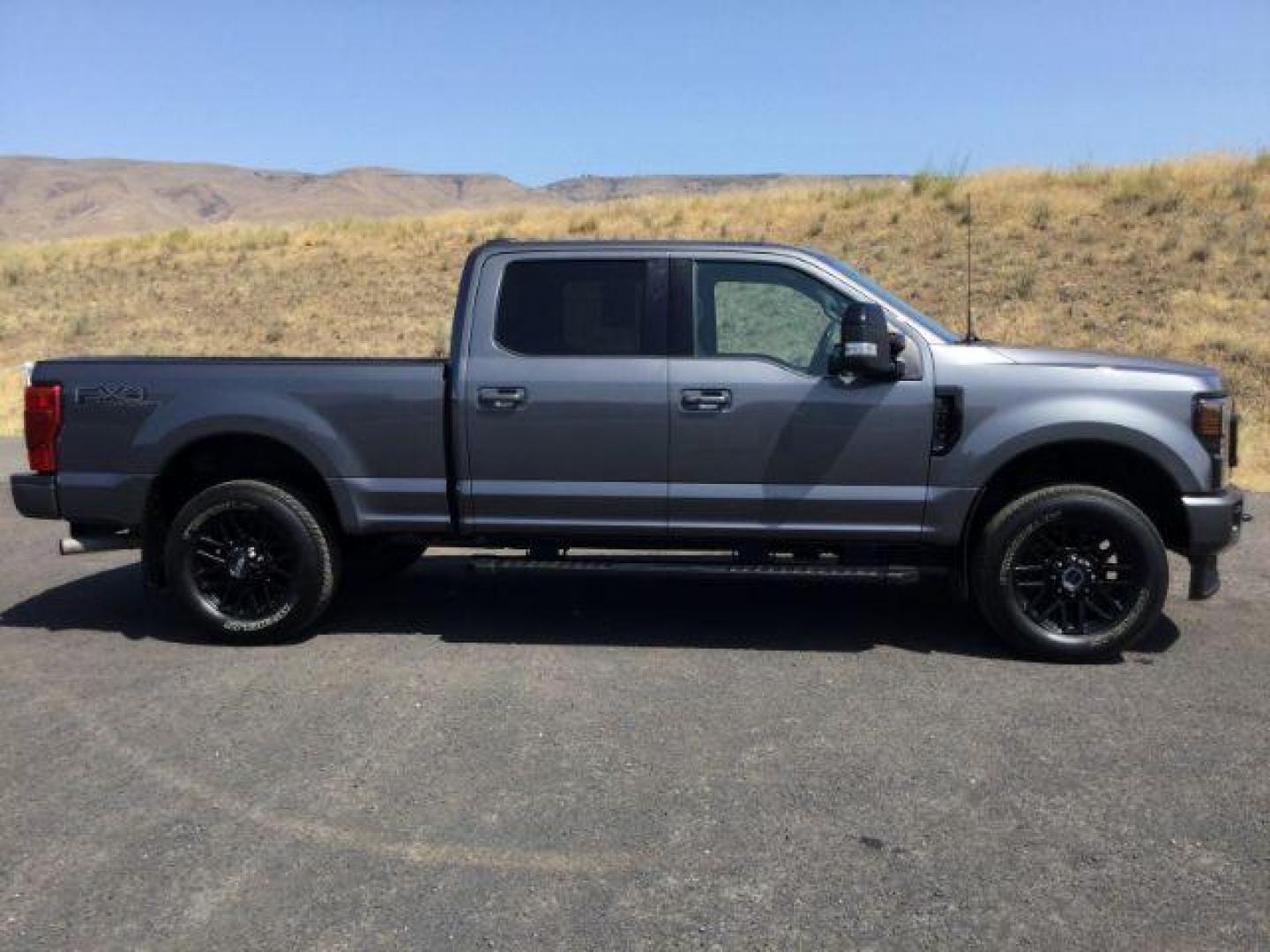 2022 Carbonized Gray Metallic /Black Onyx Ford F-350 Lariat (1FT8W3BN6NE) with an 7.3L V-8 variable valve control engine, Automatic, 10-Spd w/SelectShift and TorqShift transmission, located at 1801 Main Street, Lewiston, 83501, (208) 743-9371, 46.417065, -117.004799 - Photo#9